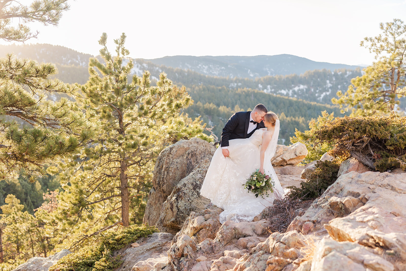 Bride and groom sharing an intimate moment at their elopement on Lost Gulch Overlook in Boulder, Colorado.