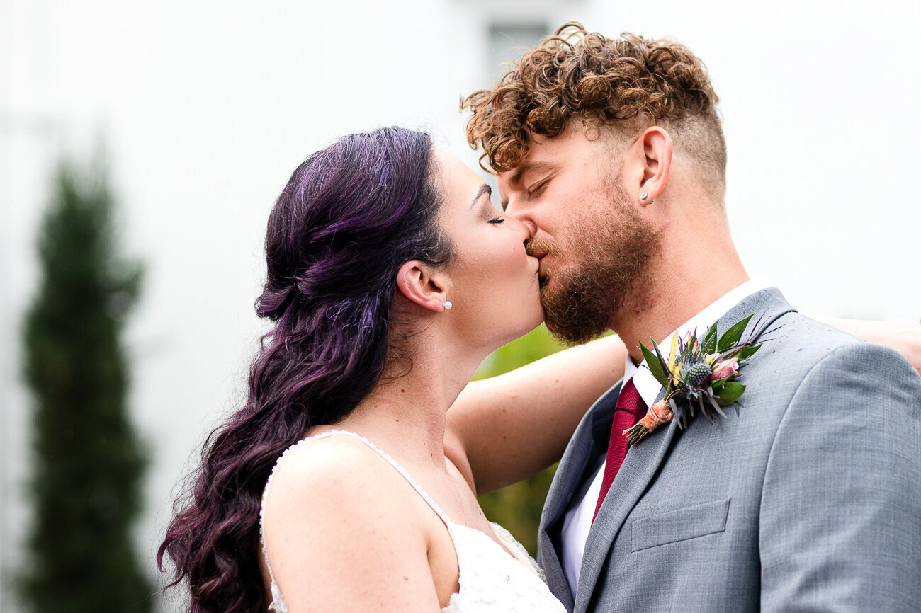 White married couple kissing