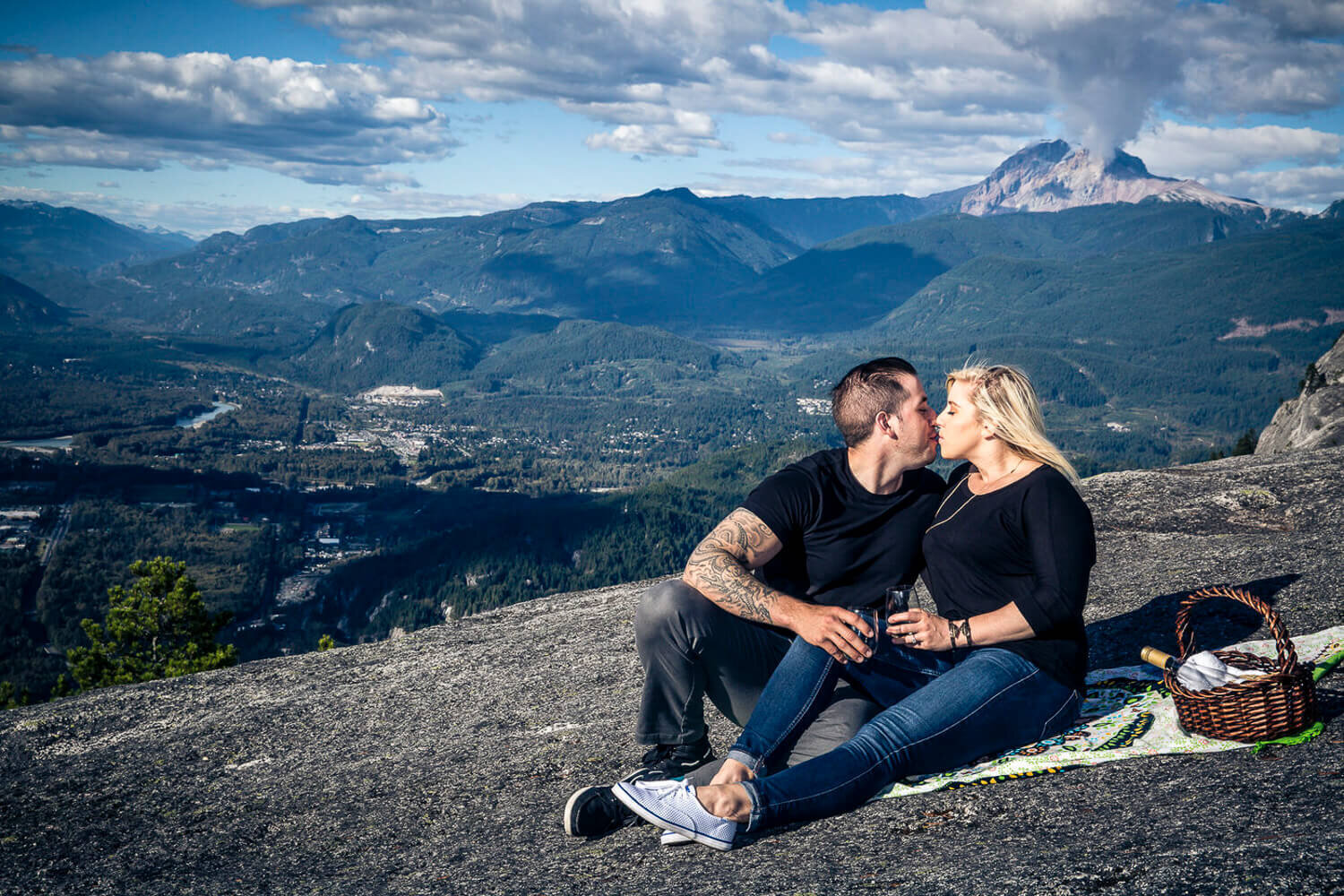 couple sitting on a mountainside