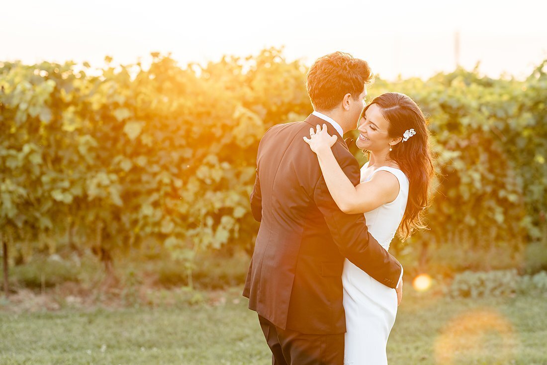 Bride-and-groom-dancing-at-sunset-in-the-vineyard-at-their-southwestern-ontario-summer-wedding