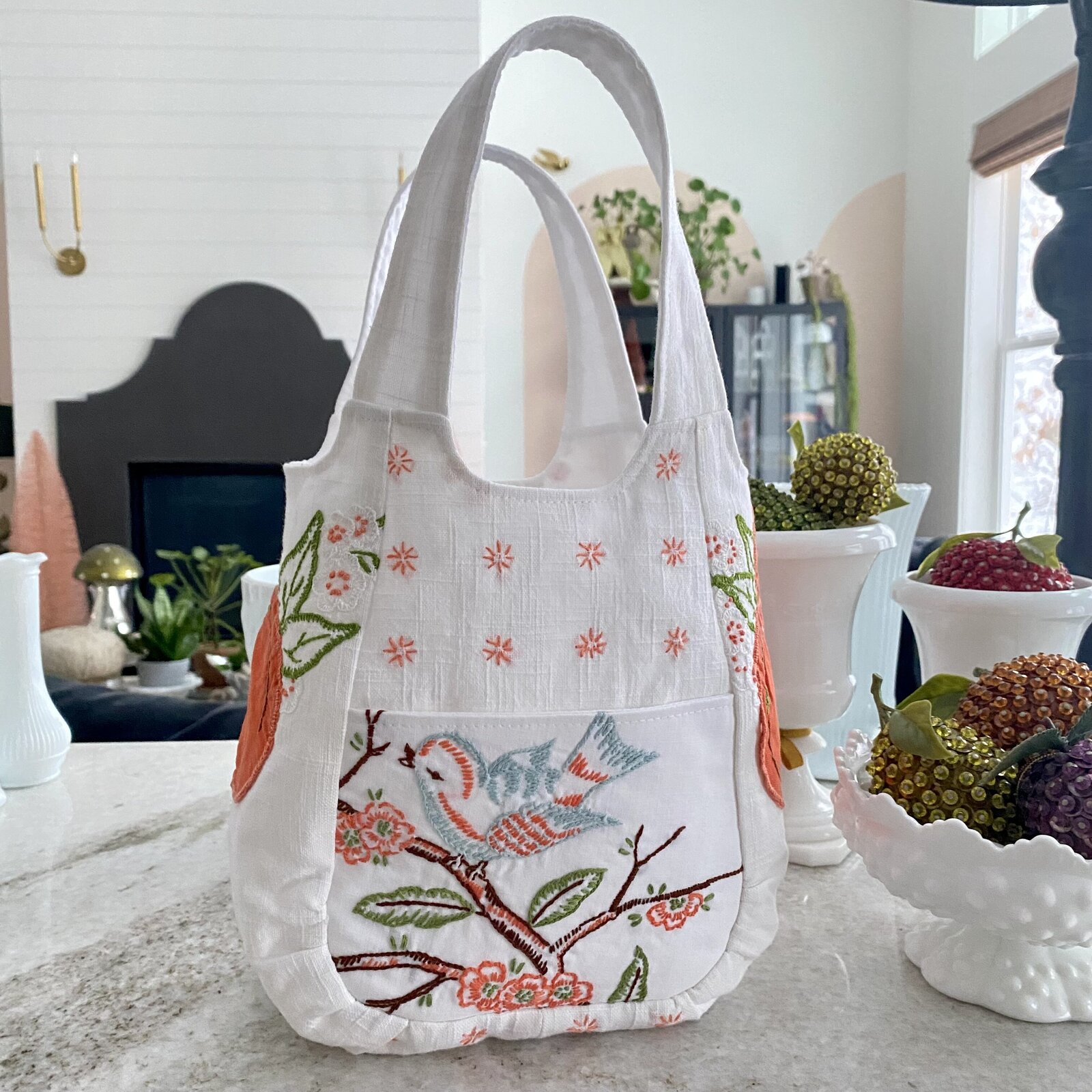 Handmade bag made out of vintage stitched linens.