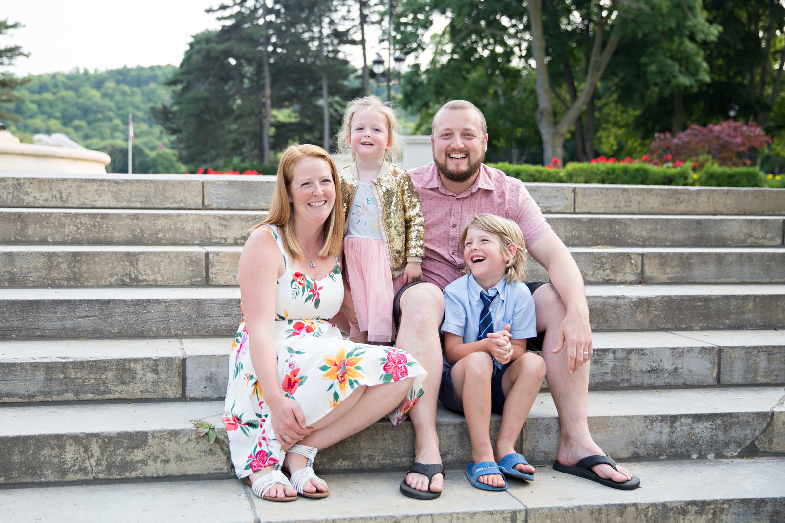 family posed on stairs at Gage Park in Hamilton floral dress