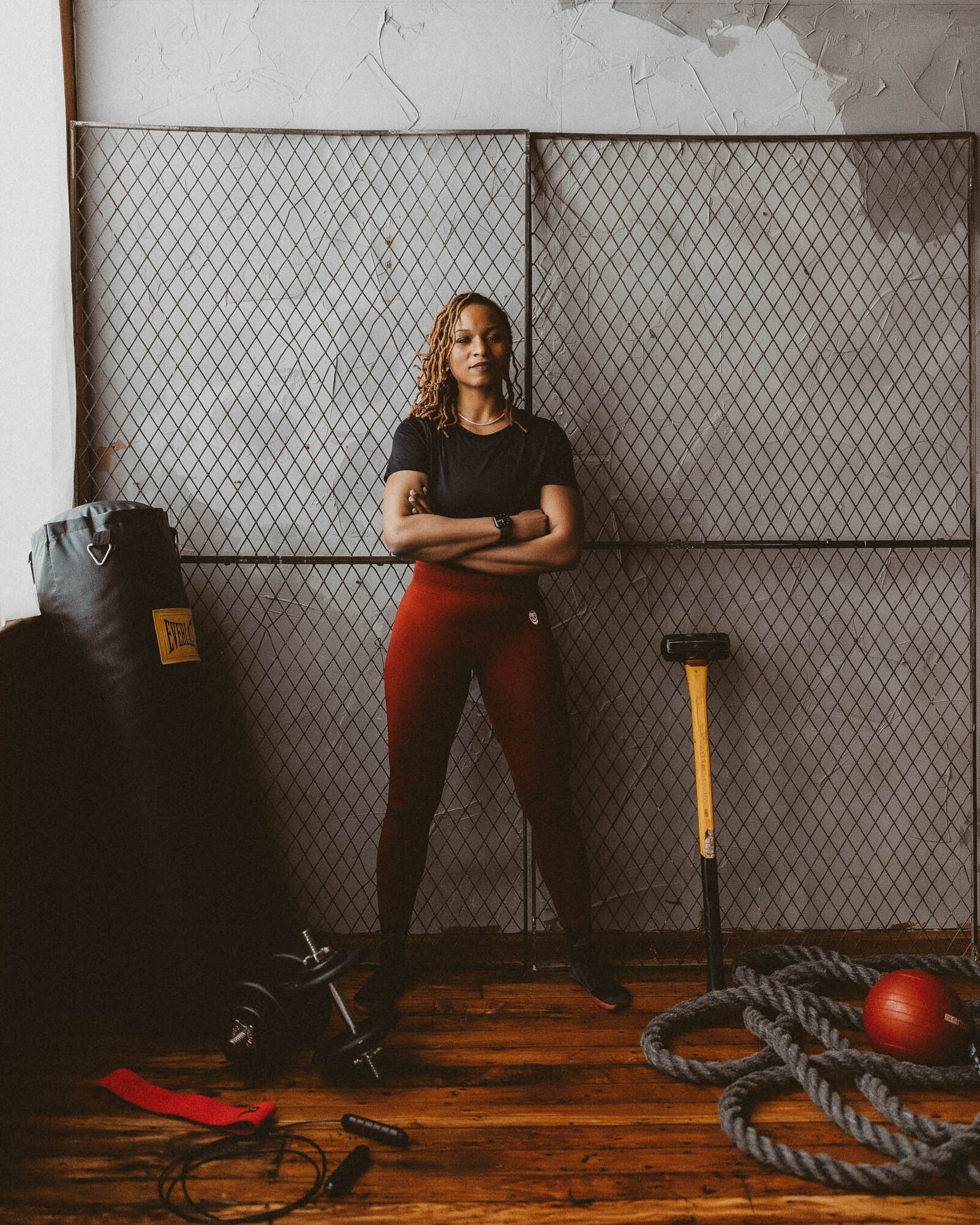 woman standing with a gym accessories on her side