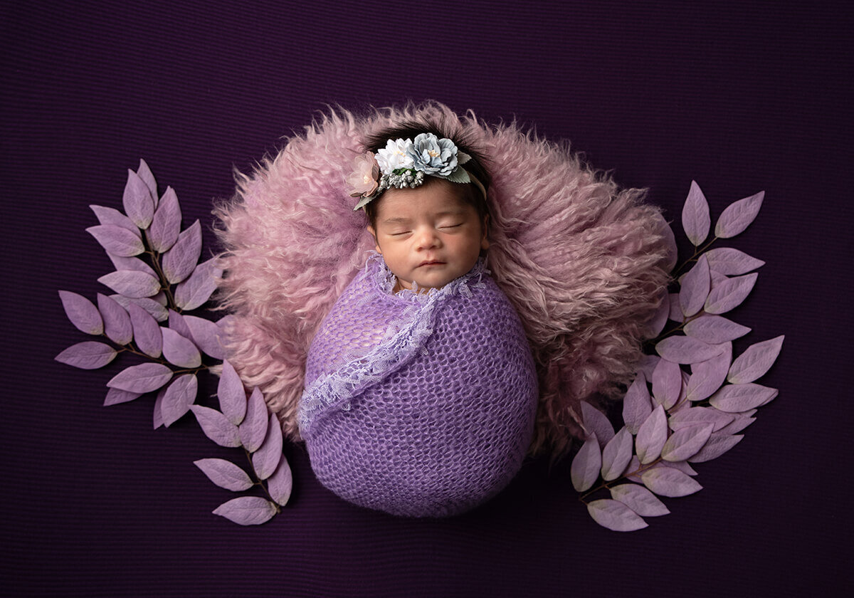 newborn wrapped in lavendar