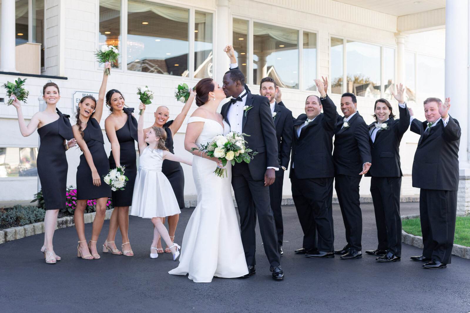 bridal party standing outside cheering at the breakers spring lake nj