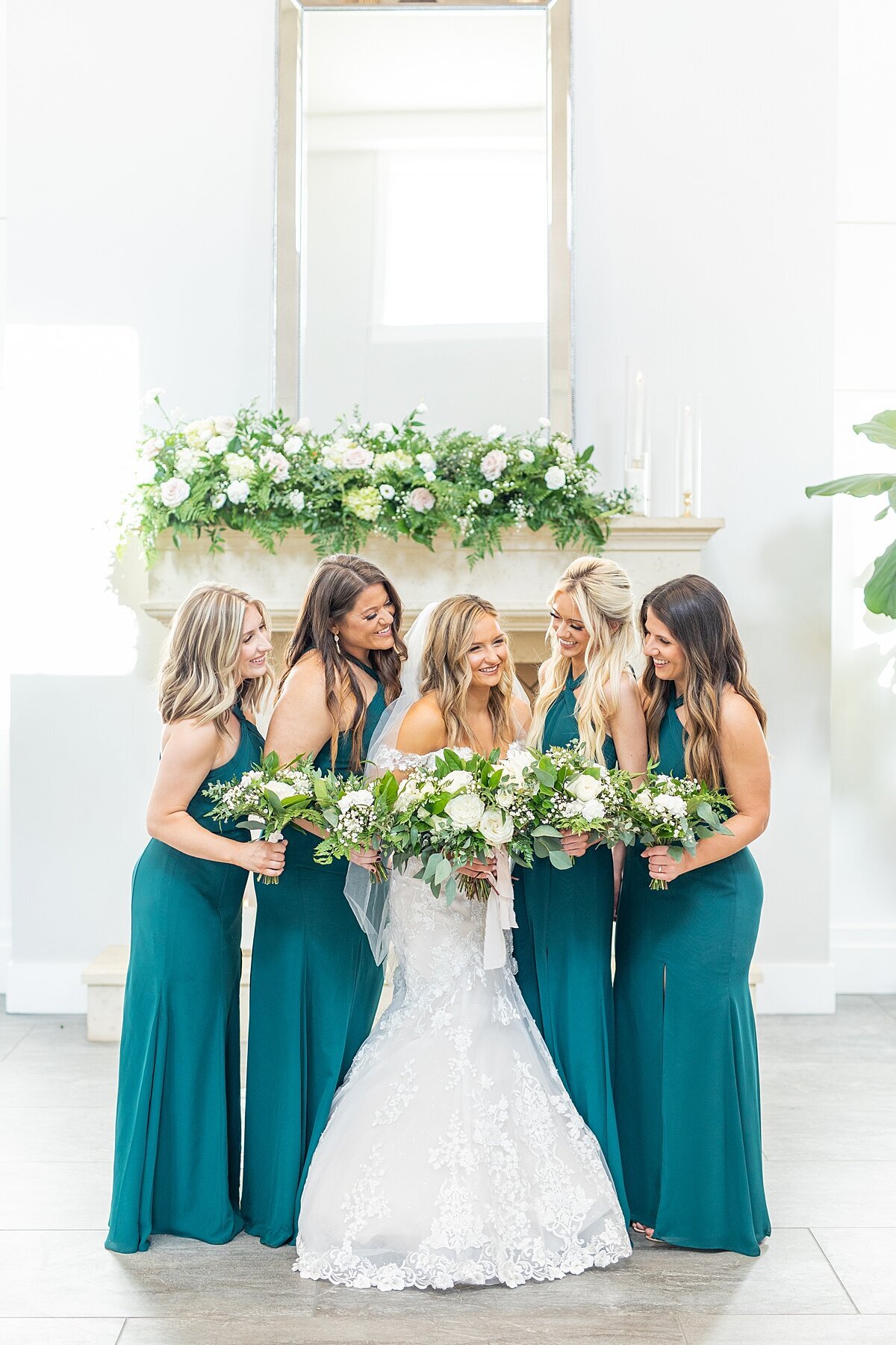 Bride and bridesmaids wearing Azazie dresses in Emerald by Sherr Weddings based in Vista, California.
