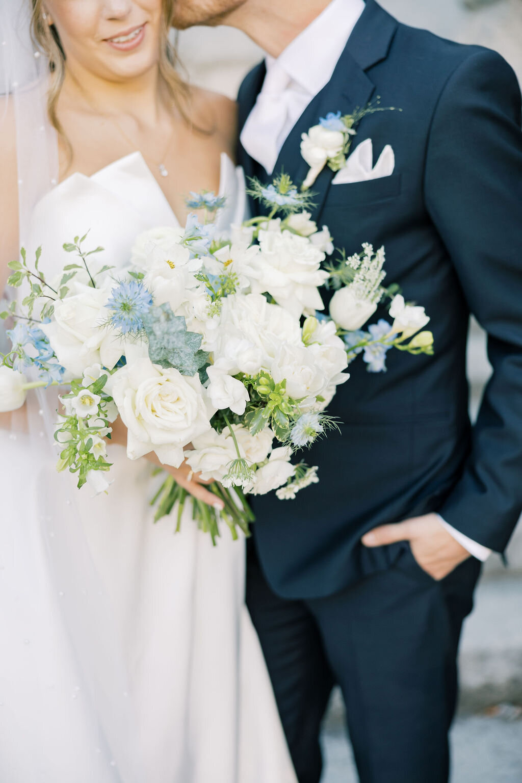 bride and groom on their wedding day romantic portrait light and airy burgundy flowers gray suit