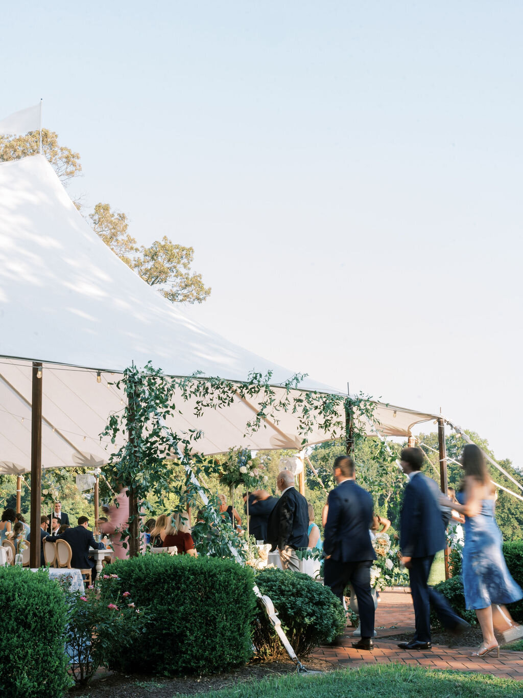 Guests walking into the reception tent at Brittland Estate.