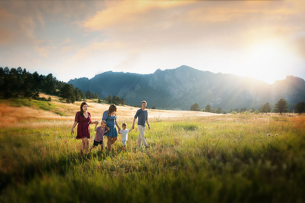 dreamy-boulder-landscape-NCAR-mountain-family-holding-hands-children-colorful