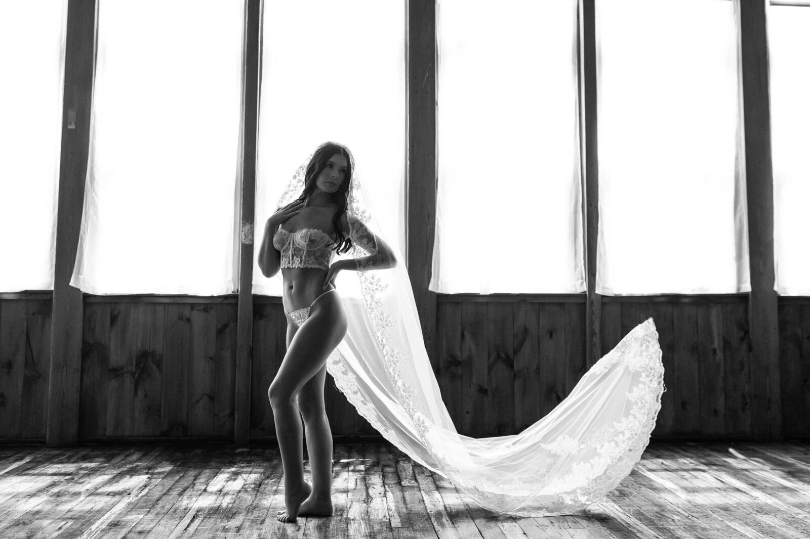 black and white photo of a woman with a long cloth