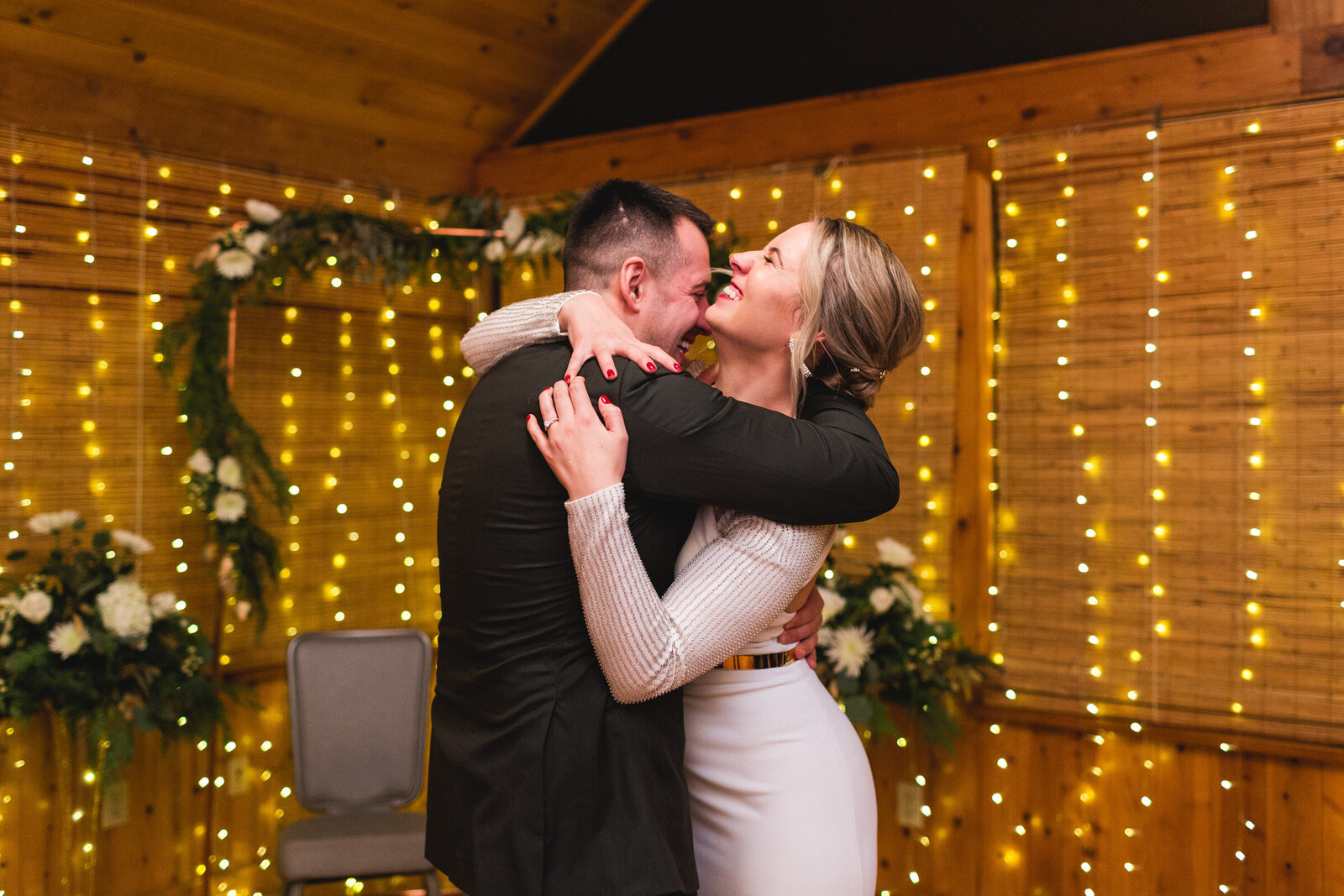 bride and groom embracing and laughing during first dance ohio wedding