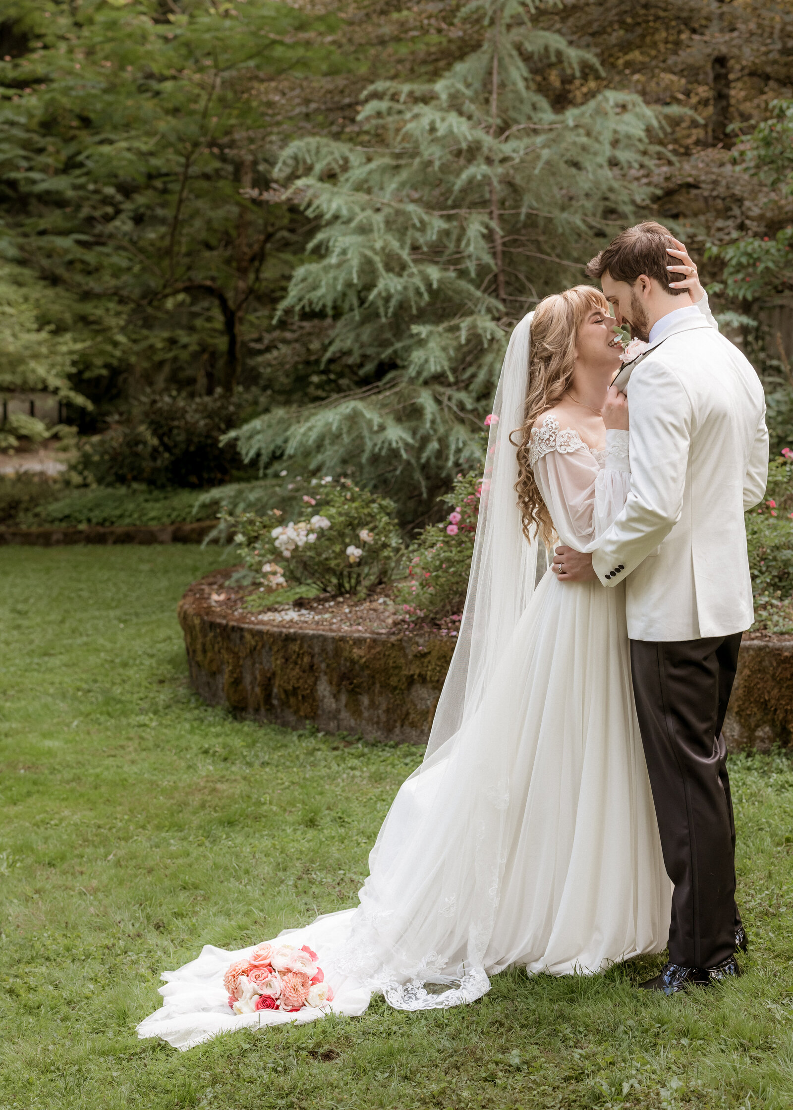 Couple kissing in front of the wedding chapel at Camp Colton in Colton, Oregon.