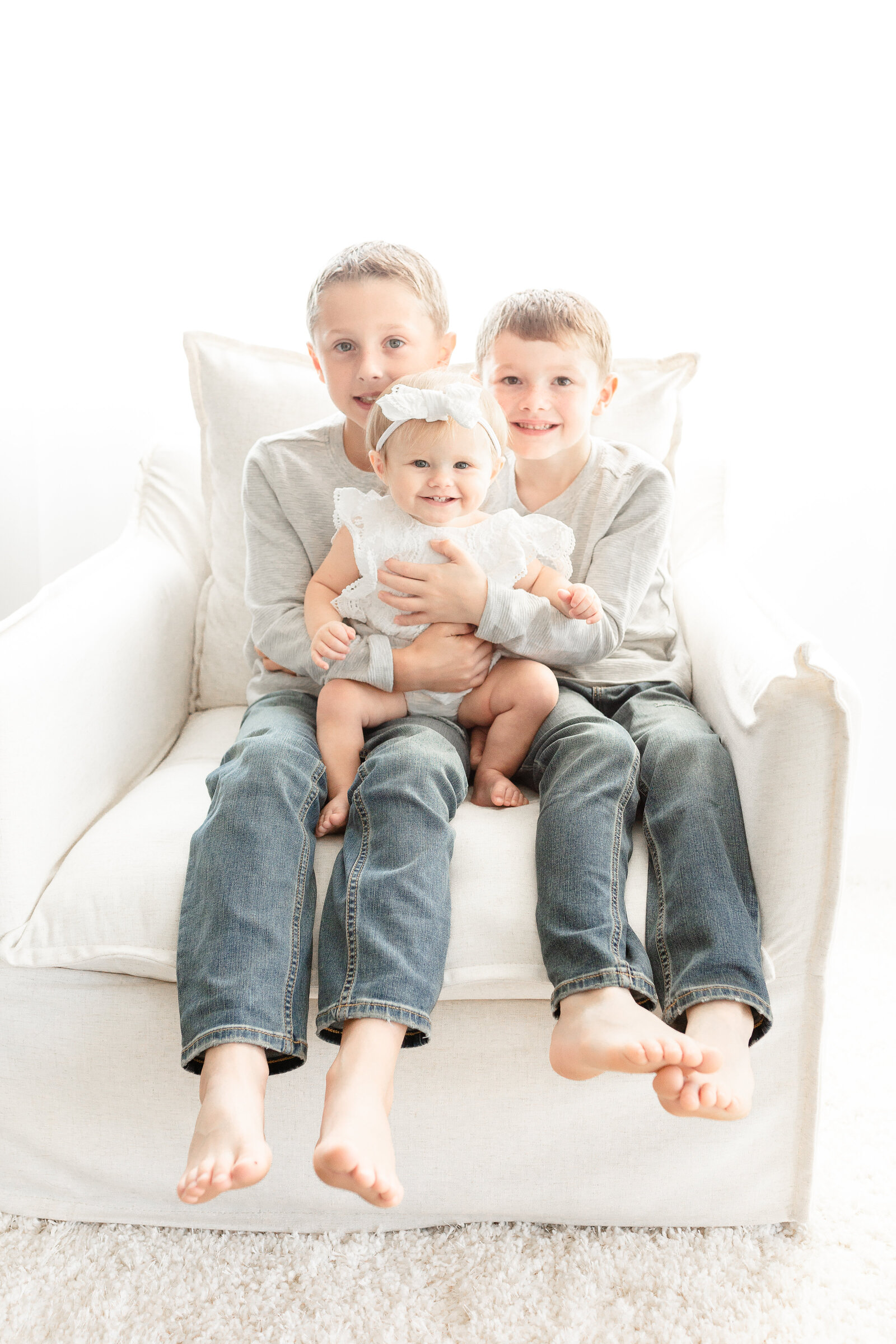 Plymouth Michigan Newborn Photographer captures siblings at first birthday cake smash session at Studio Neue