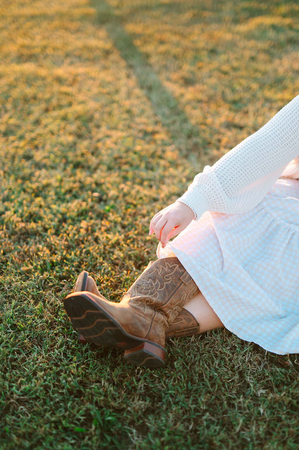 a close up of a girl wearing cowgirl boots
