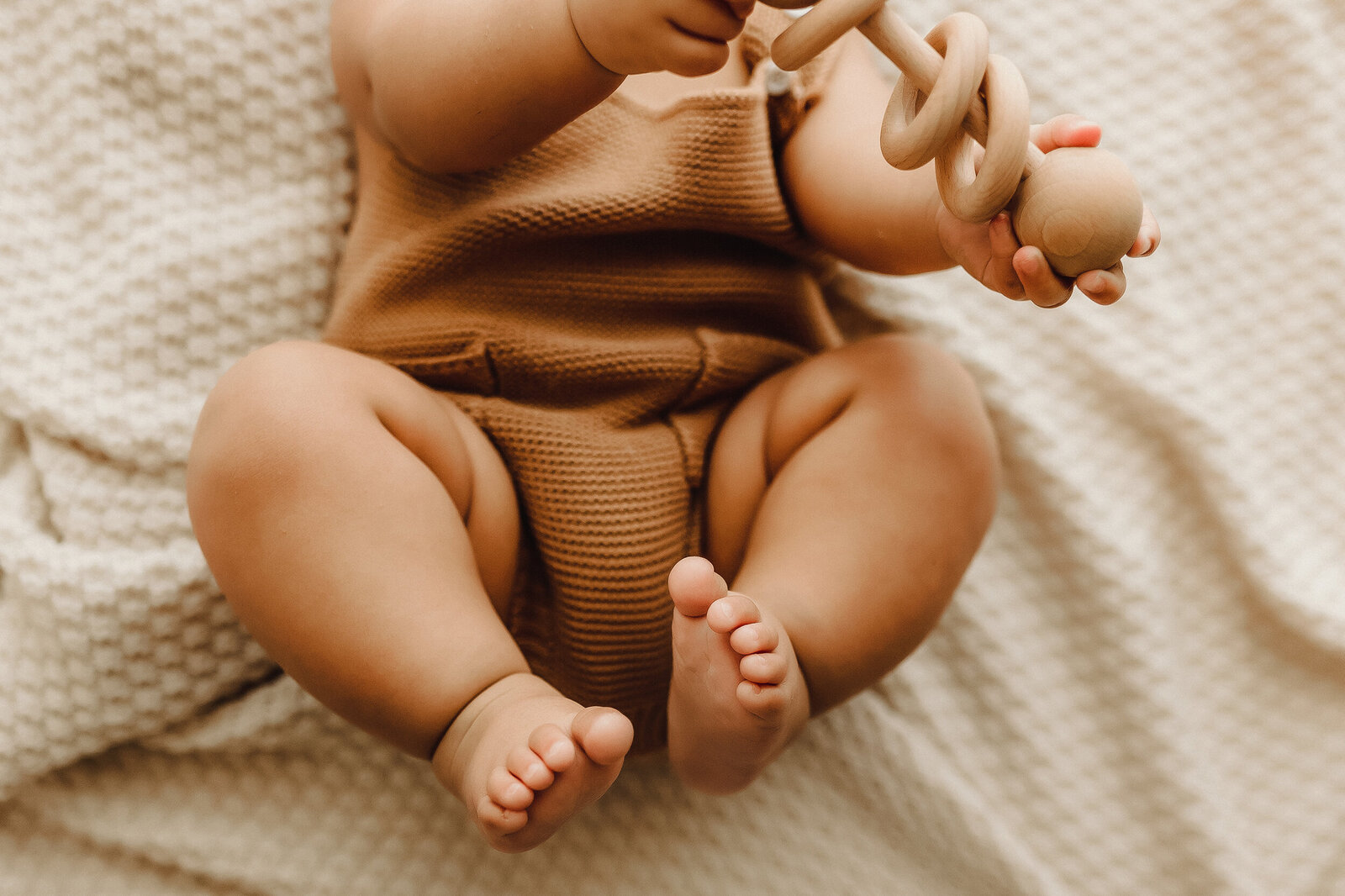 precious details of a 6 month old baby boy's chunky thighs and pudgy feet