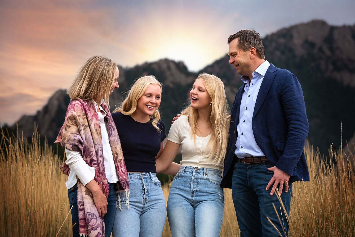 family-laughing-teenage-girls-mountain-background-flatirons-NCAR-swedish-boulder-candid-family-pictures-best-photographer