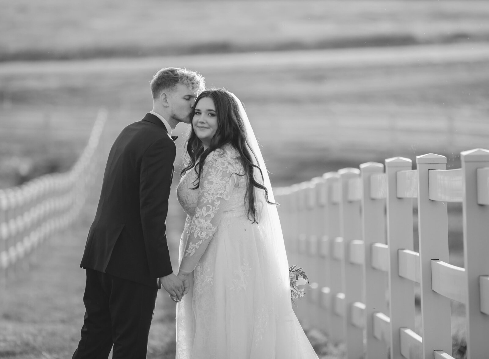 groom kissing bride