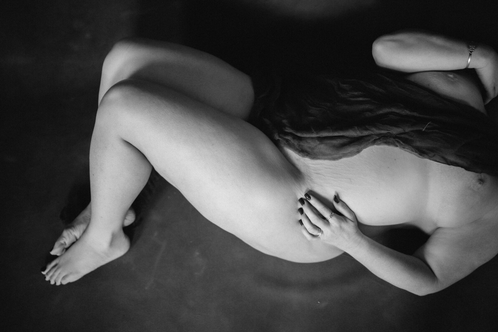 Black and white nude photo of a woman