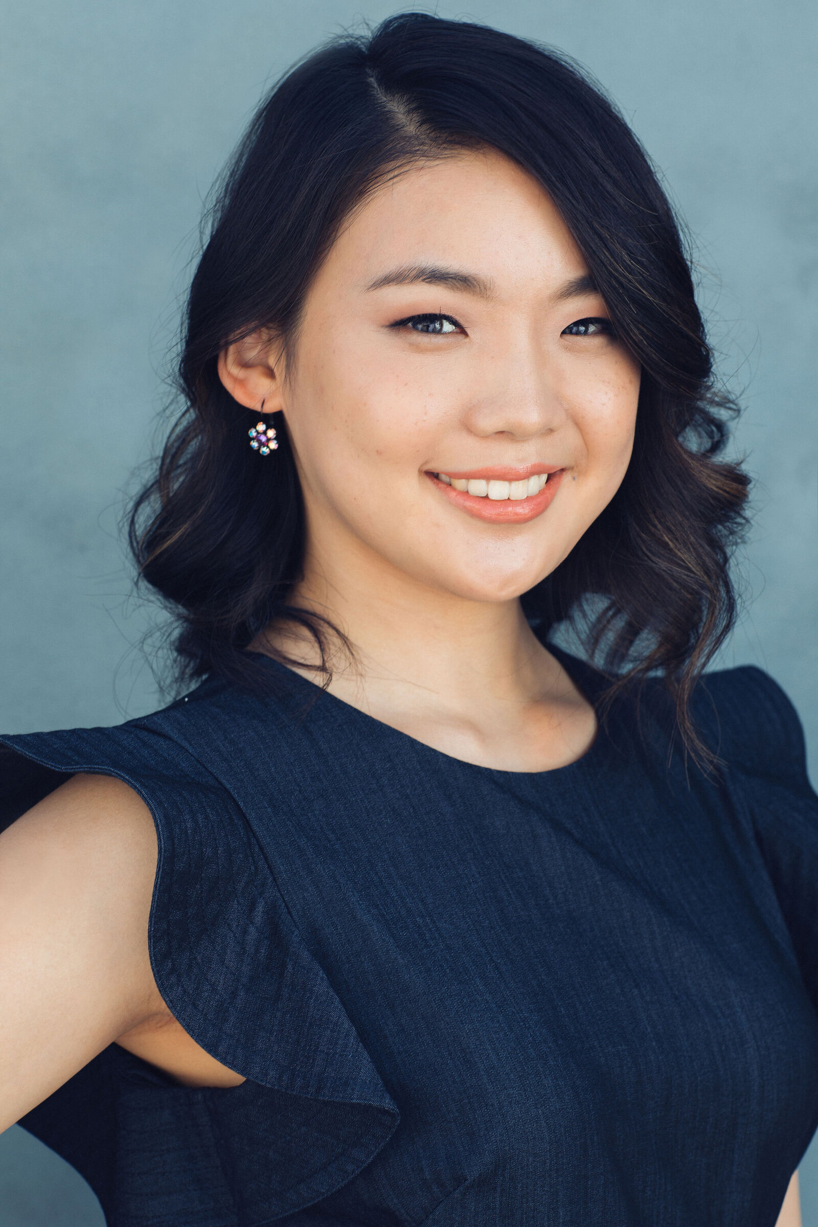 Headshot Photograph Of Young Woman In Navy Blue Sleeveless Los Angeles