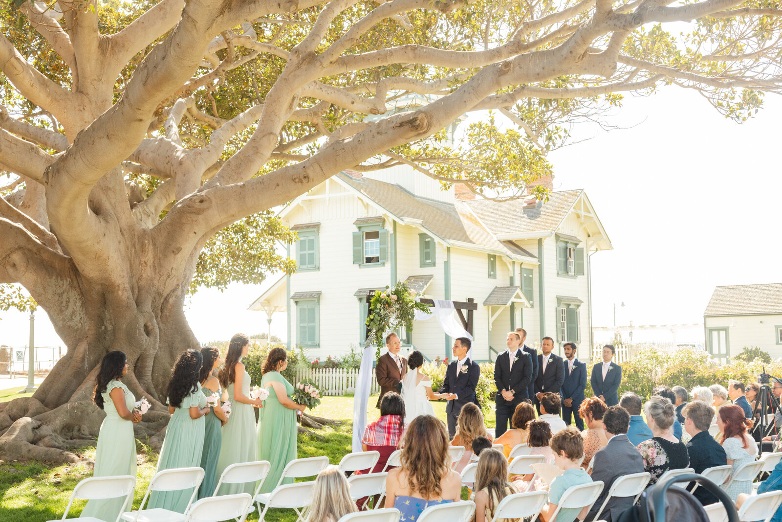 A wedding ceremony underneath a large tree in Los Angeles, Ca.