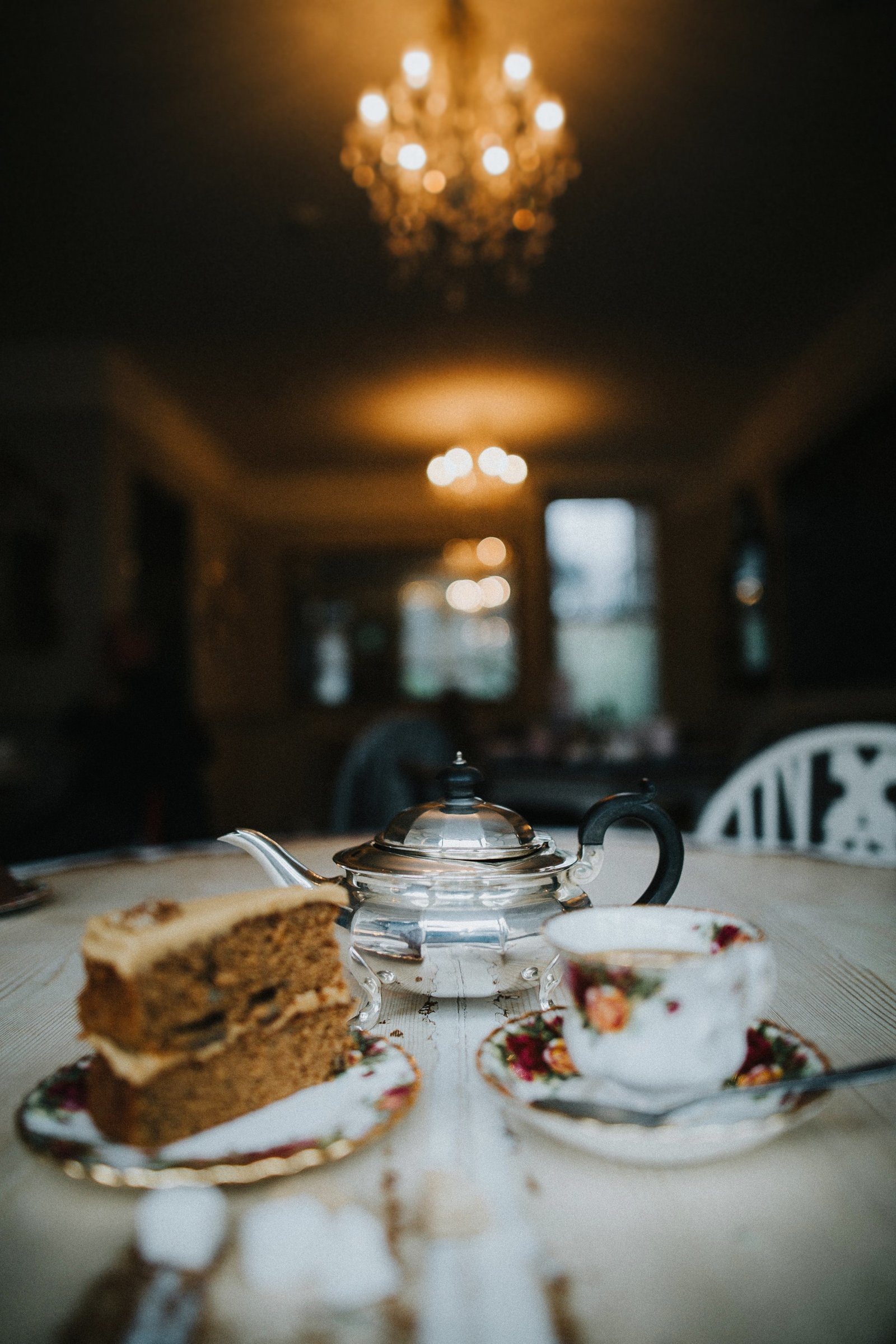 Teapot, teacup and cake set out on table at Baldry's Tearoom in Grasmere Village, The Lake District