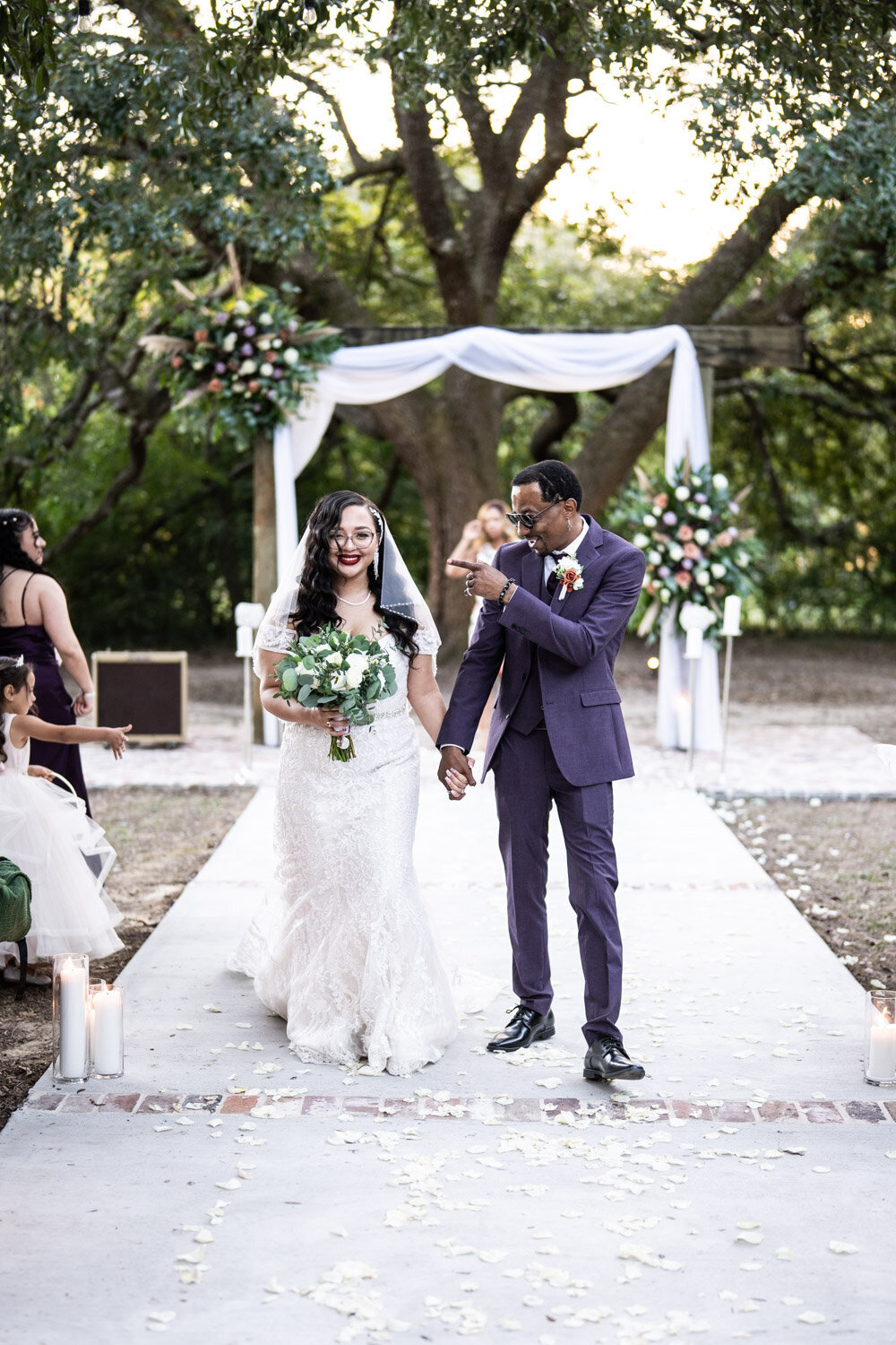 Bride and groom walking out at end of wedding ceremony at Norris Oaks