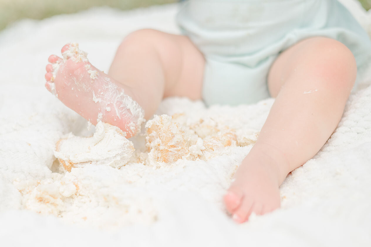 baby feet with icing during DMV milestone photos