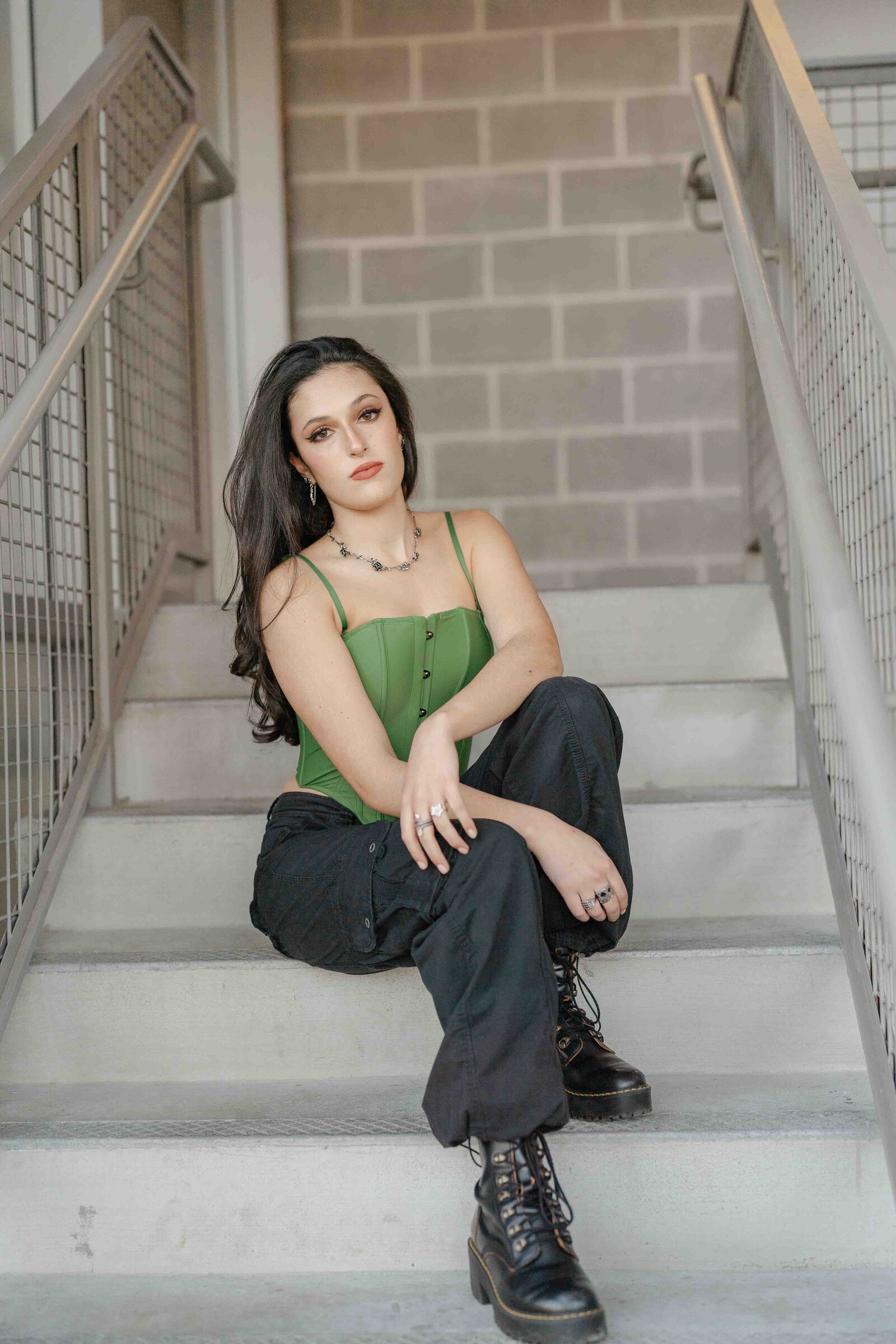 high school girl sitting on the stairs during Reston, Virginia senior picture