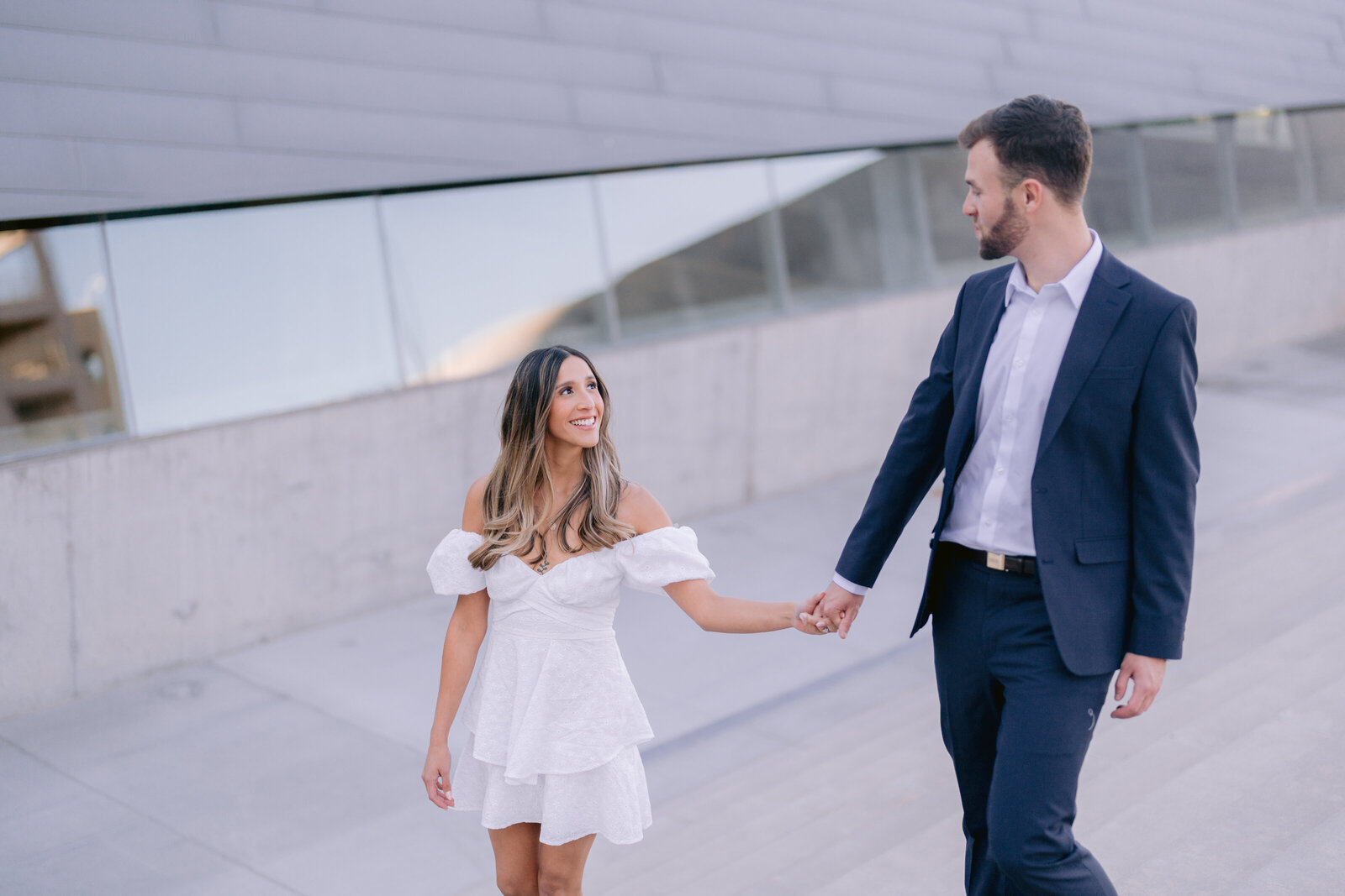Couple poses for engagement photos in downtown Phoenix Arizona