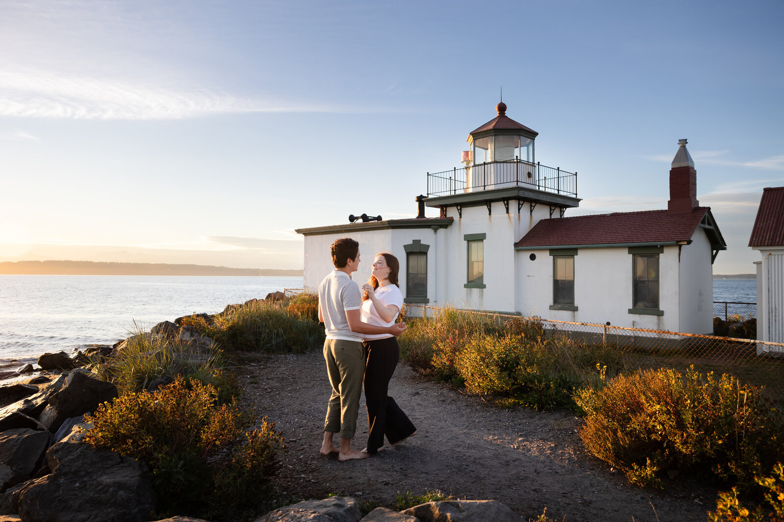 Surprise engagement proposal at Discovery park lighthouse in Seattle, Washington
