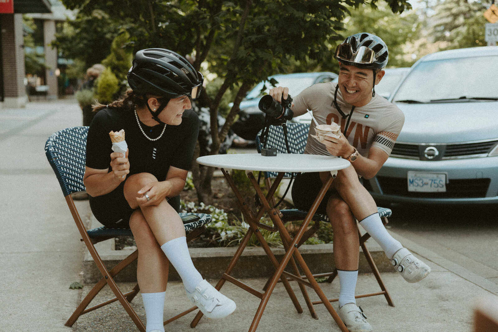Female and Male Cyclists Smiling White Carb Loading on Ice Cream