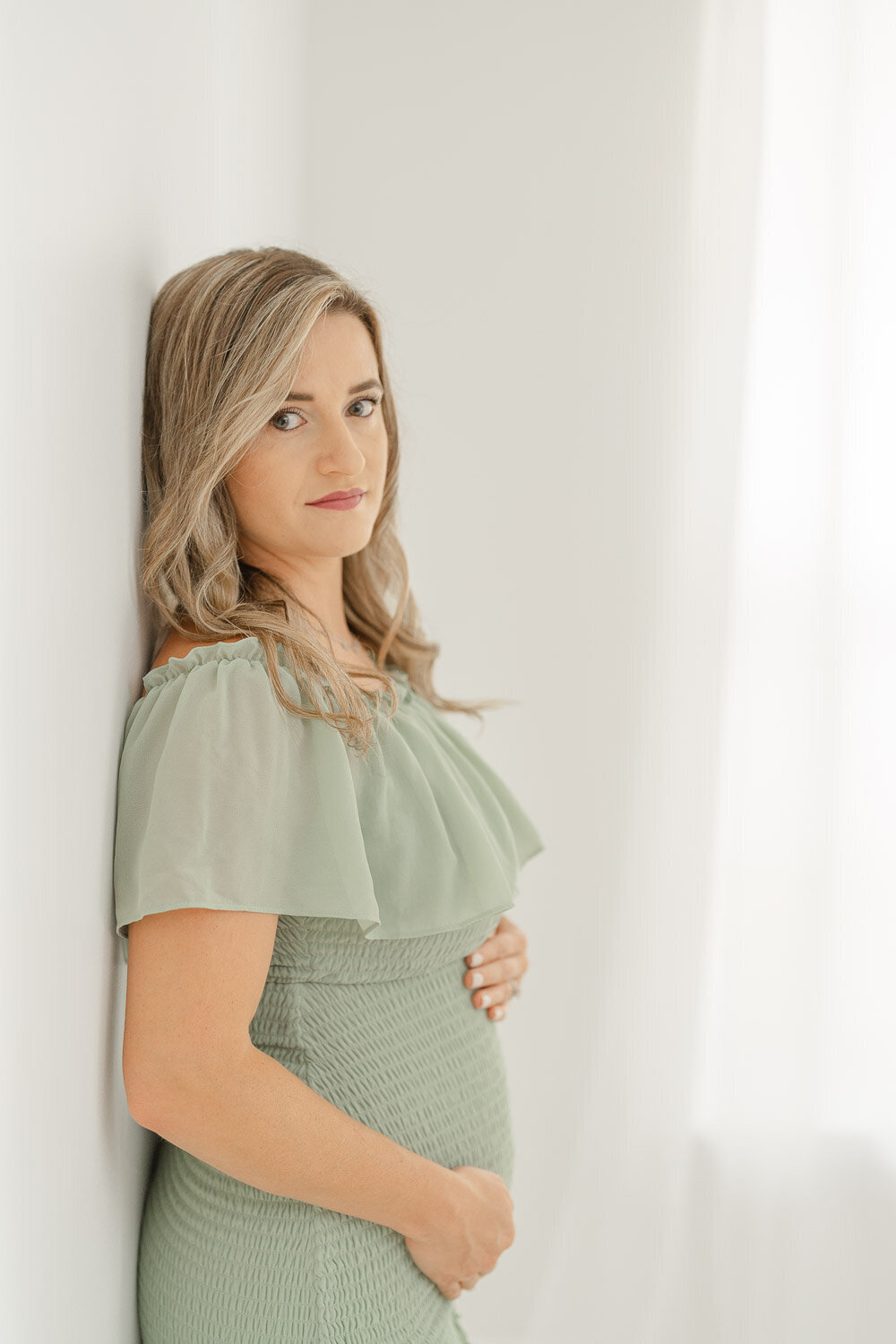 expecting mom with a serious look during Gainesville,Virginia maternity picture