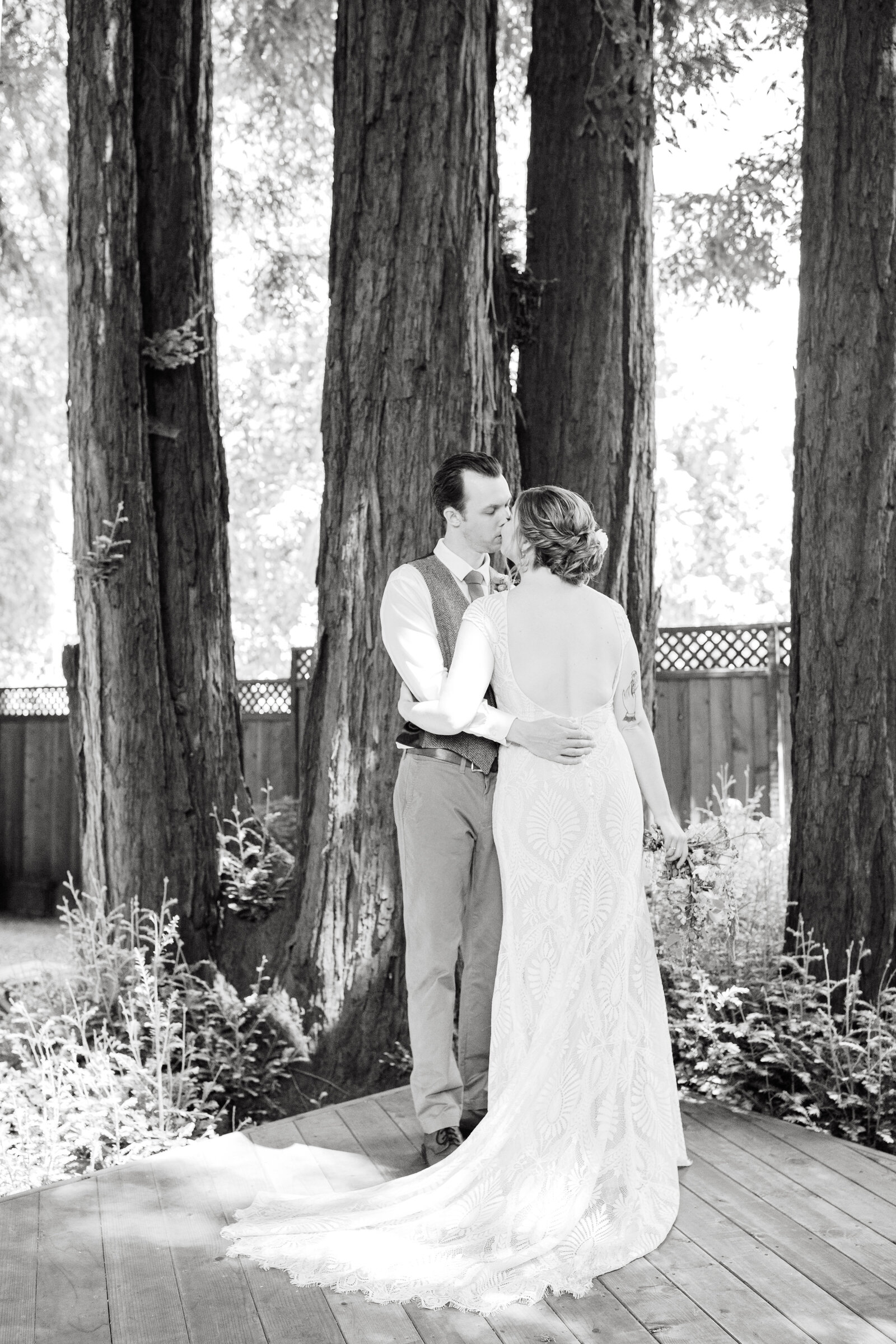 Bride and groom on their colorful wedding day in Santa Cruz, California in the redwood trees.