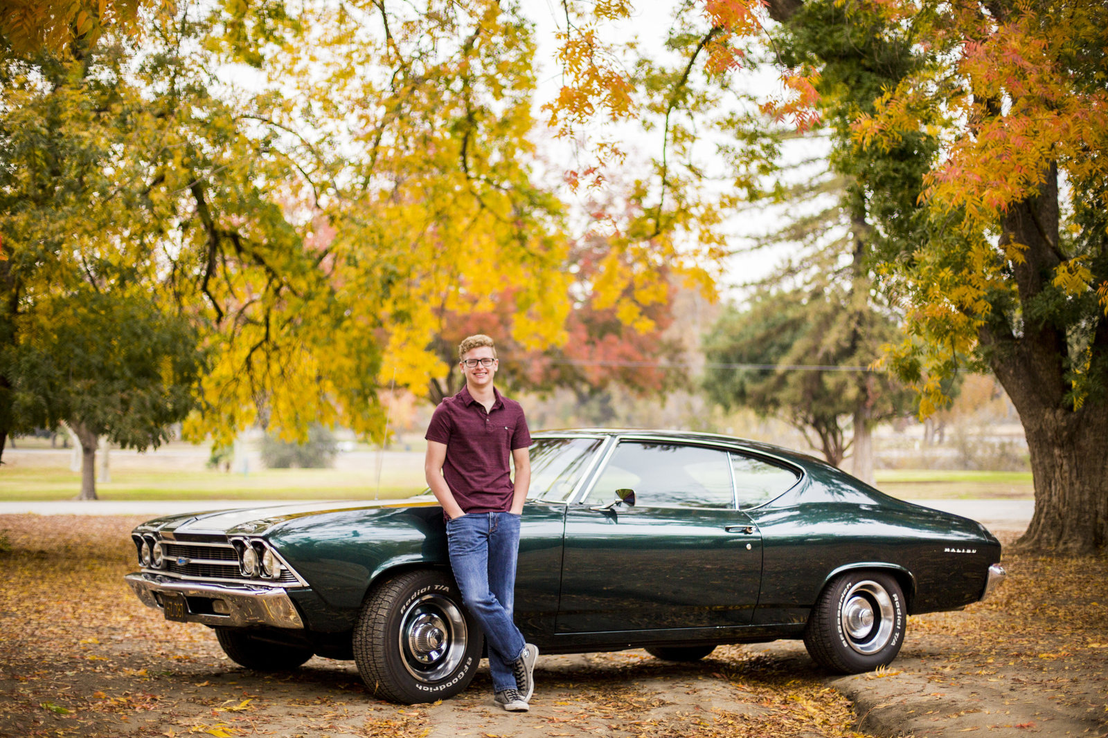 Senior Photography, senior boy standing in front of classic muscle car