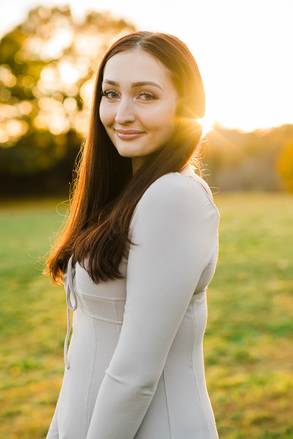 senior girl in park at sunet