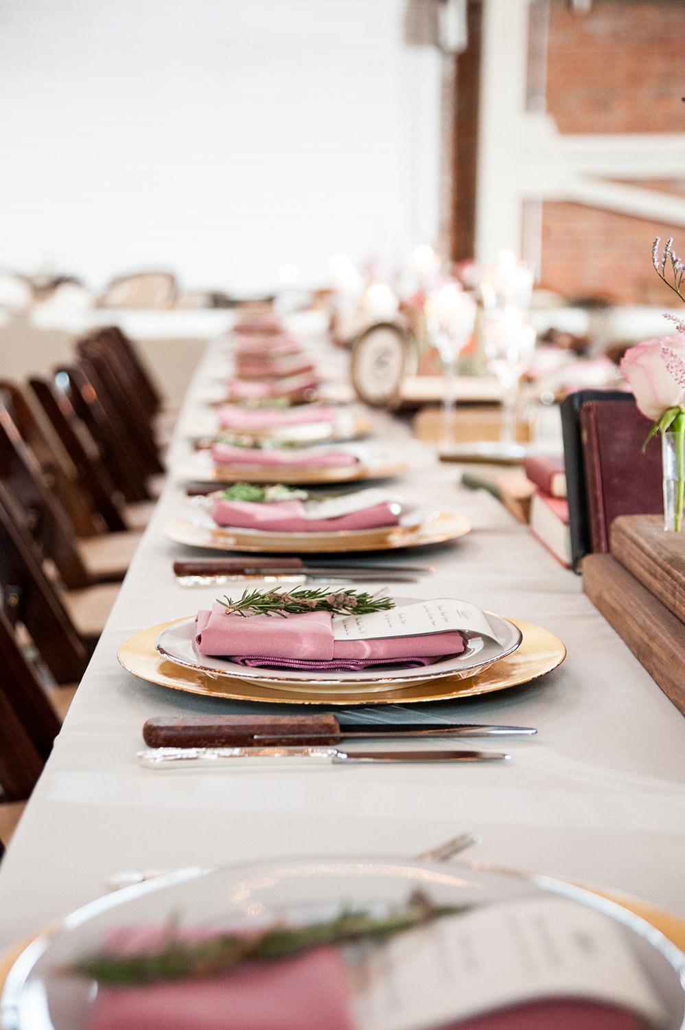 reception photo of brick with stunning details and farm tables