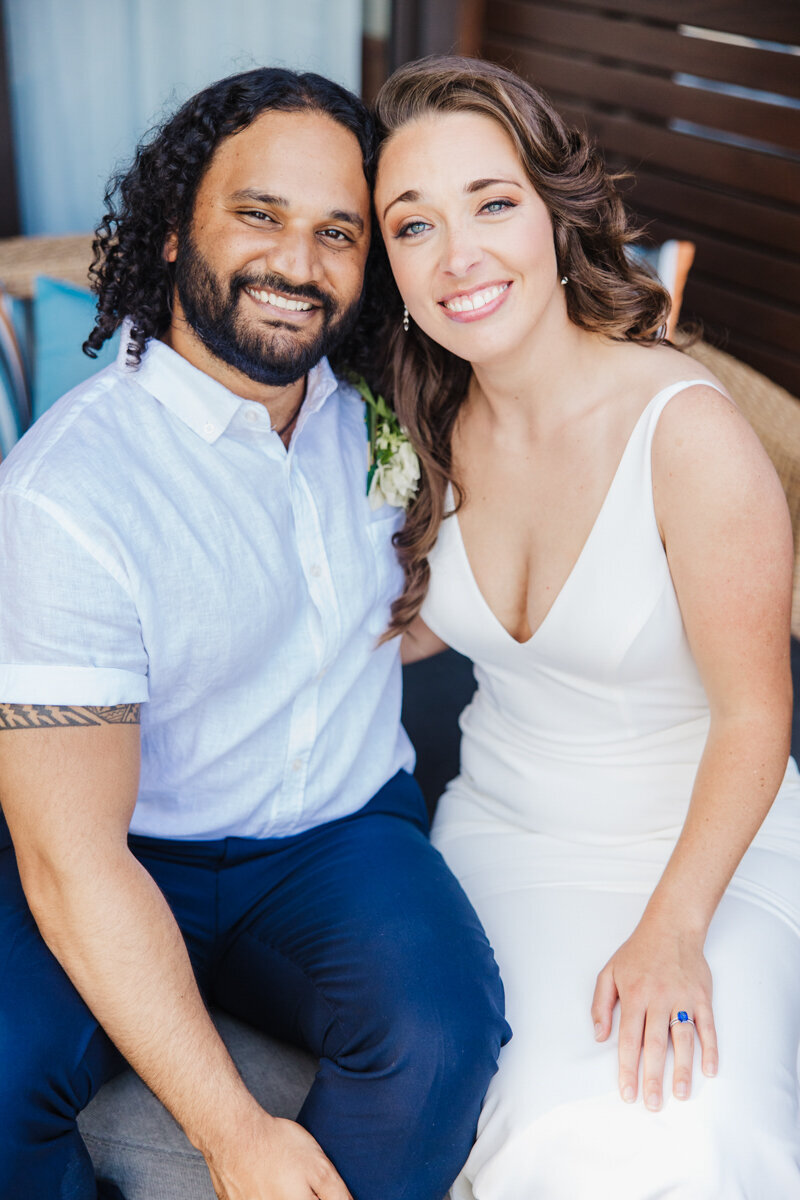 bride and groom sitting down for photos