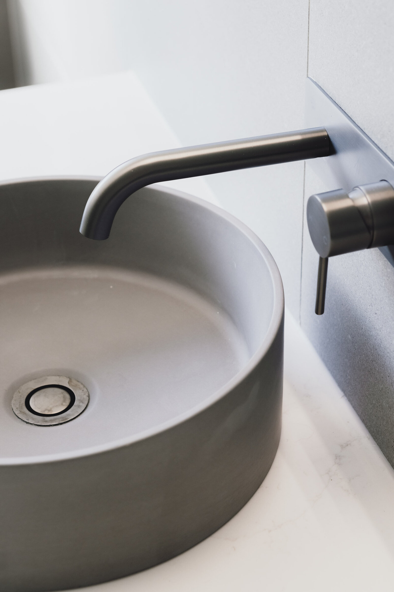 Sleek deisgn with moder basin and tapwear in custom built bathroom