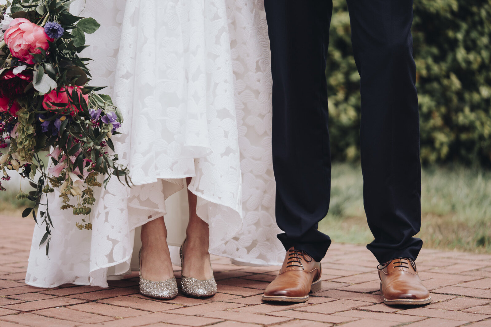 Bride with sparkly shoes and groom with brown shoes