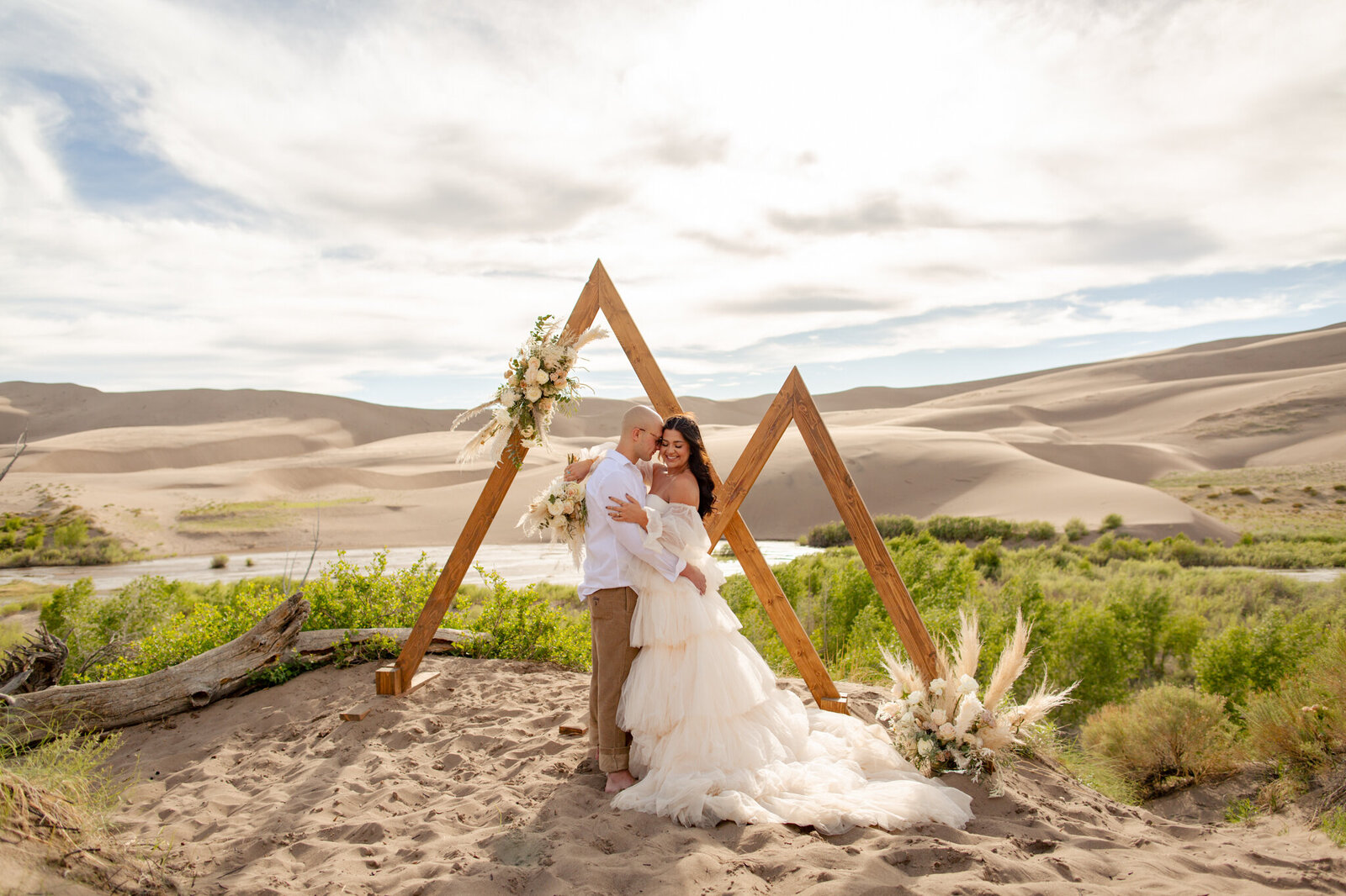 Bride and groom have their wedding ceremony at the Sand Dunes National Park