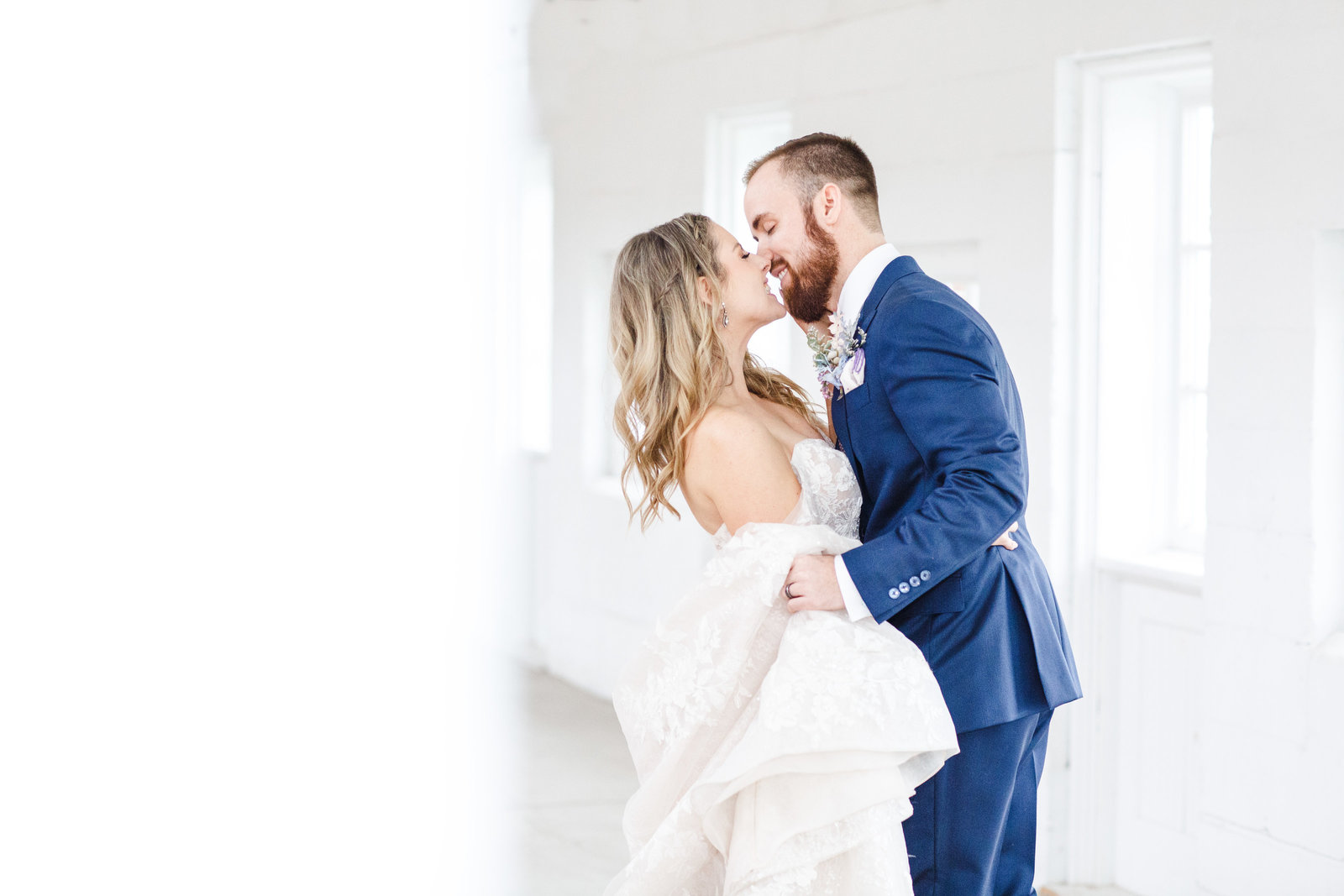 Husband and wife kissing photographed by Ohio wedding photographers, The Cannons Photography