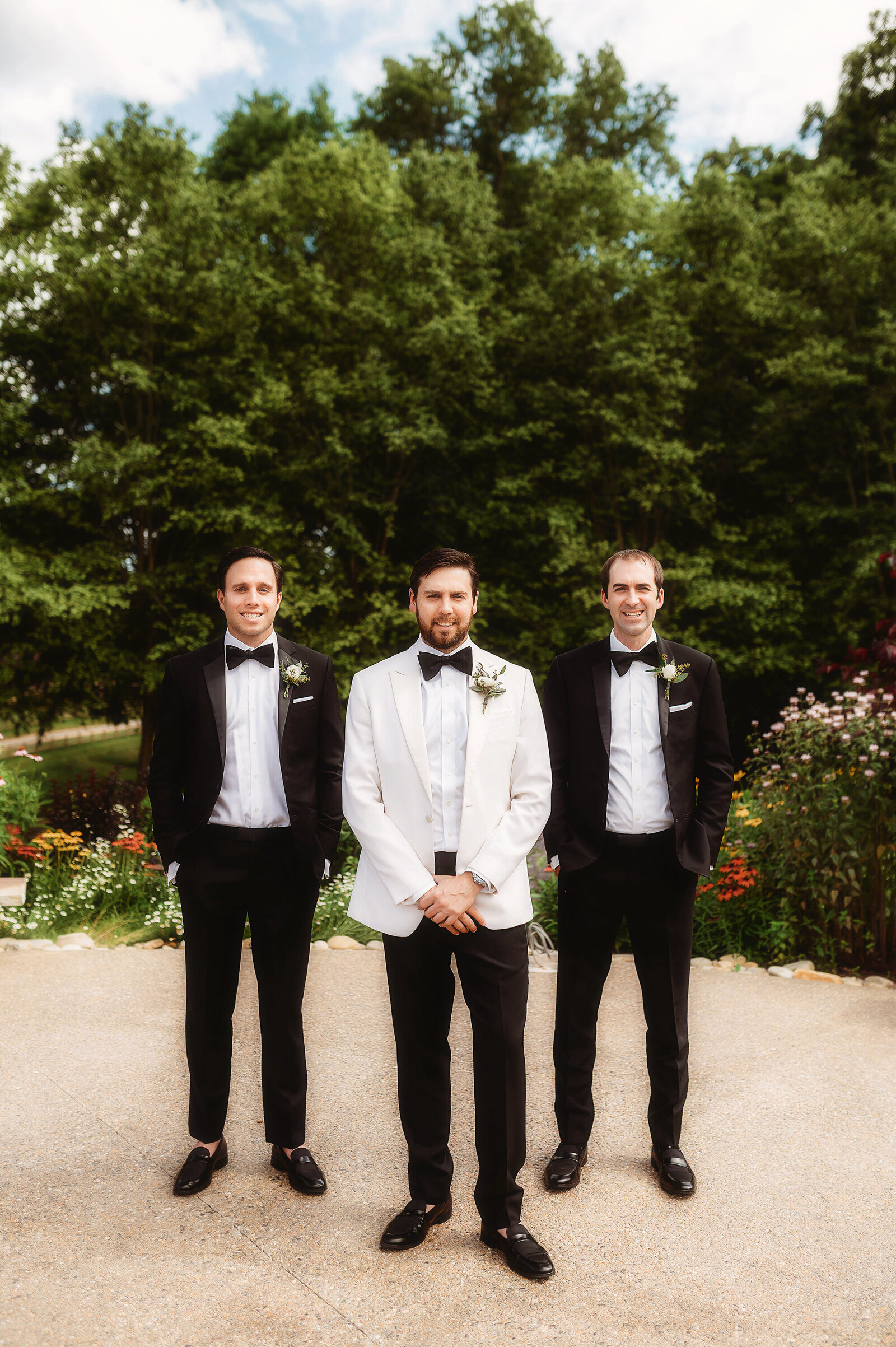 Groom poses with his brothers before his Micro-Wedding Ceremony at The Farm in Asheville, NC.