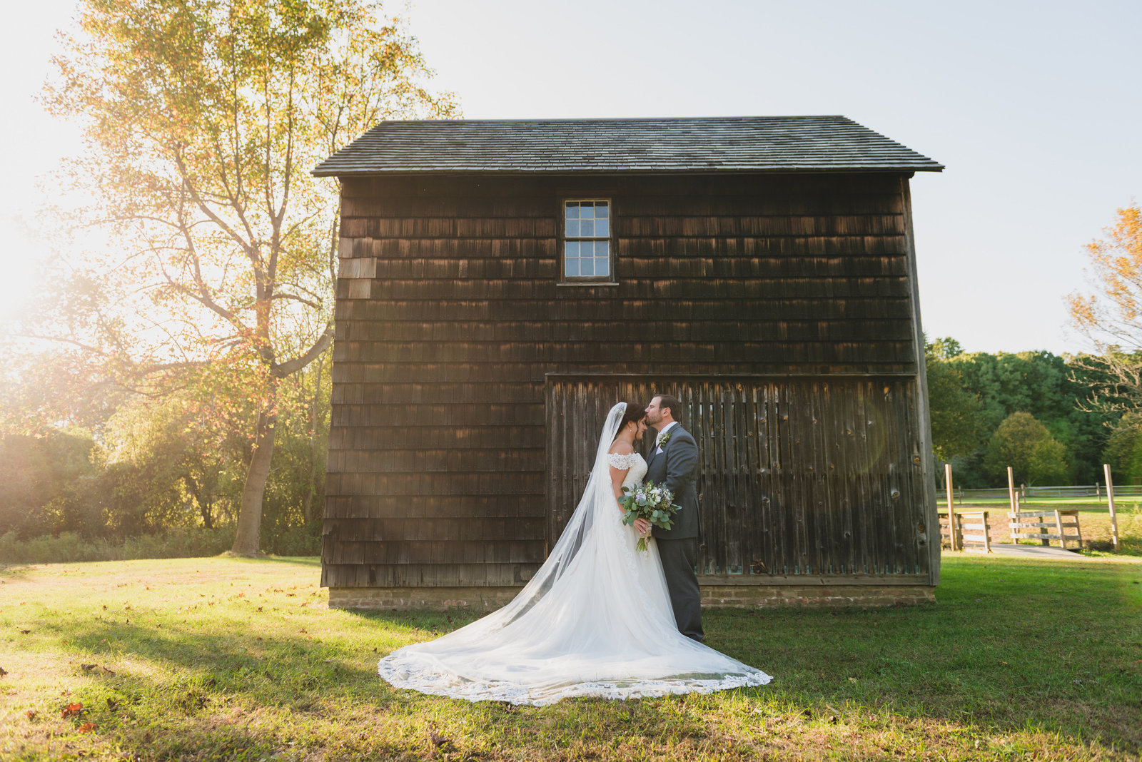 bride and groom posing at The Barn at Old Bethpage