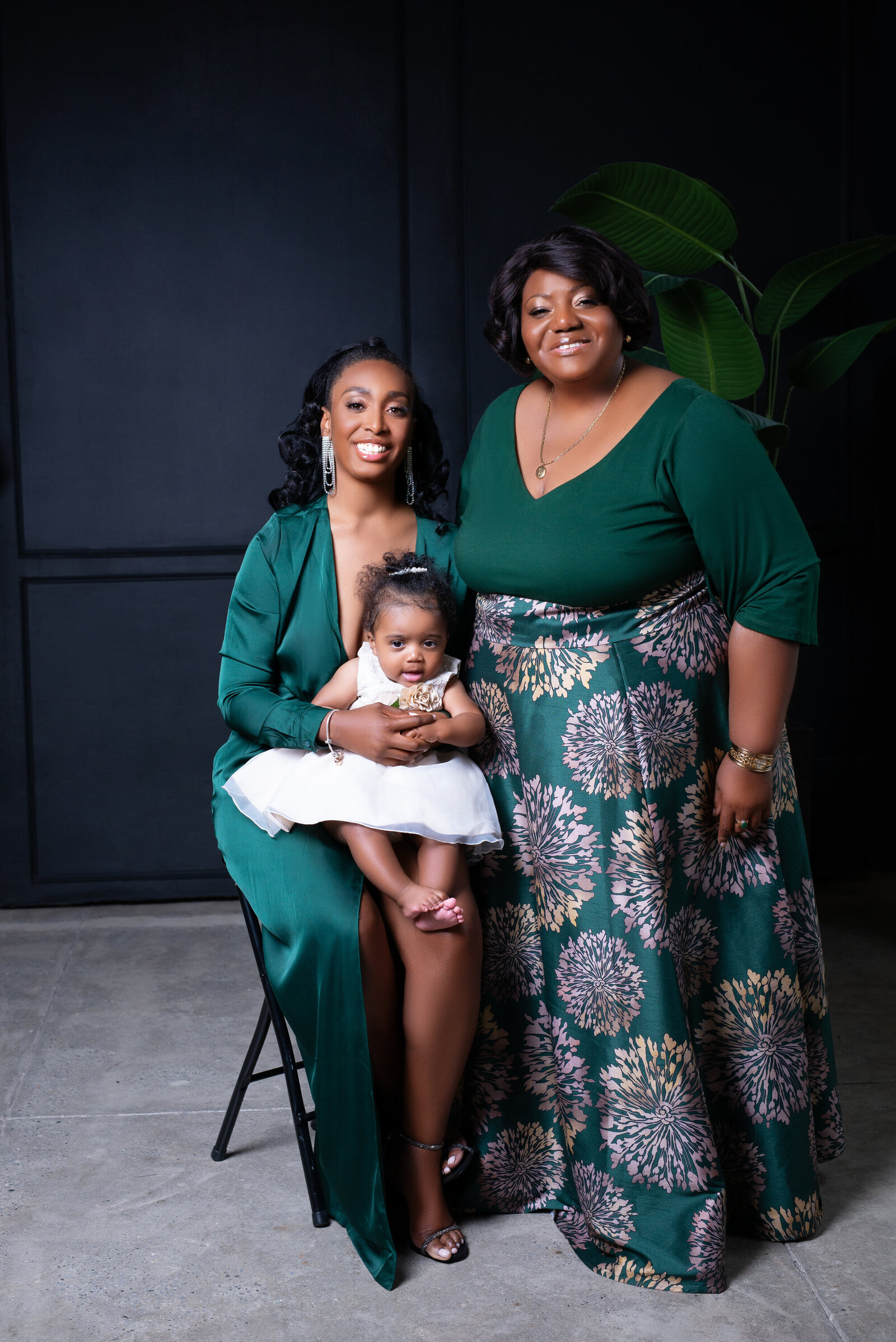 Mom poses for portrait with daughter and mother