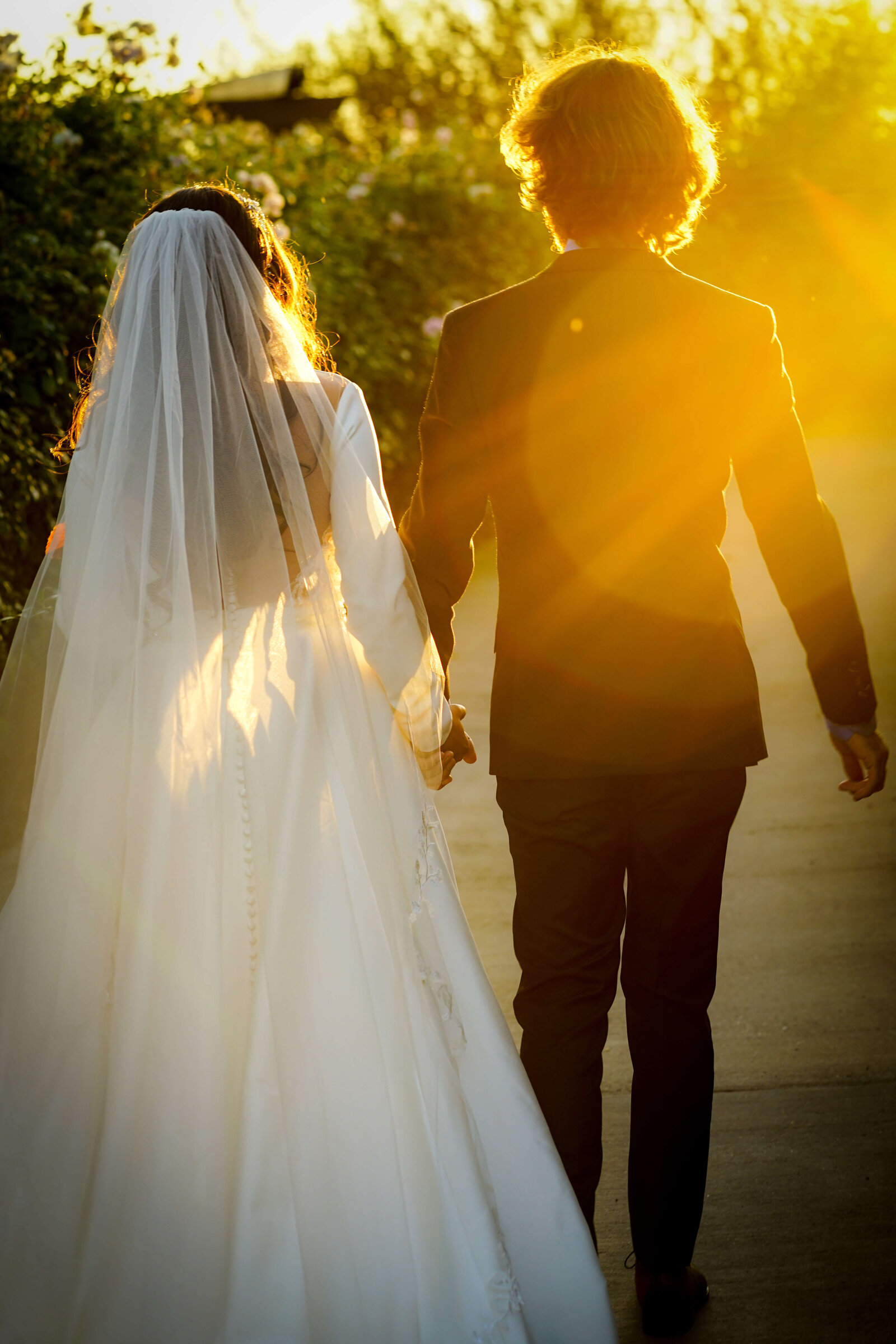 Newport Beach Wedding Photographer couple walking at sunset
