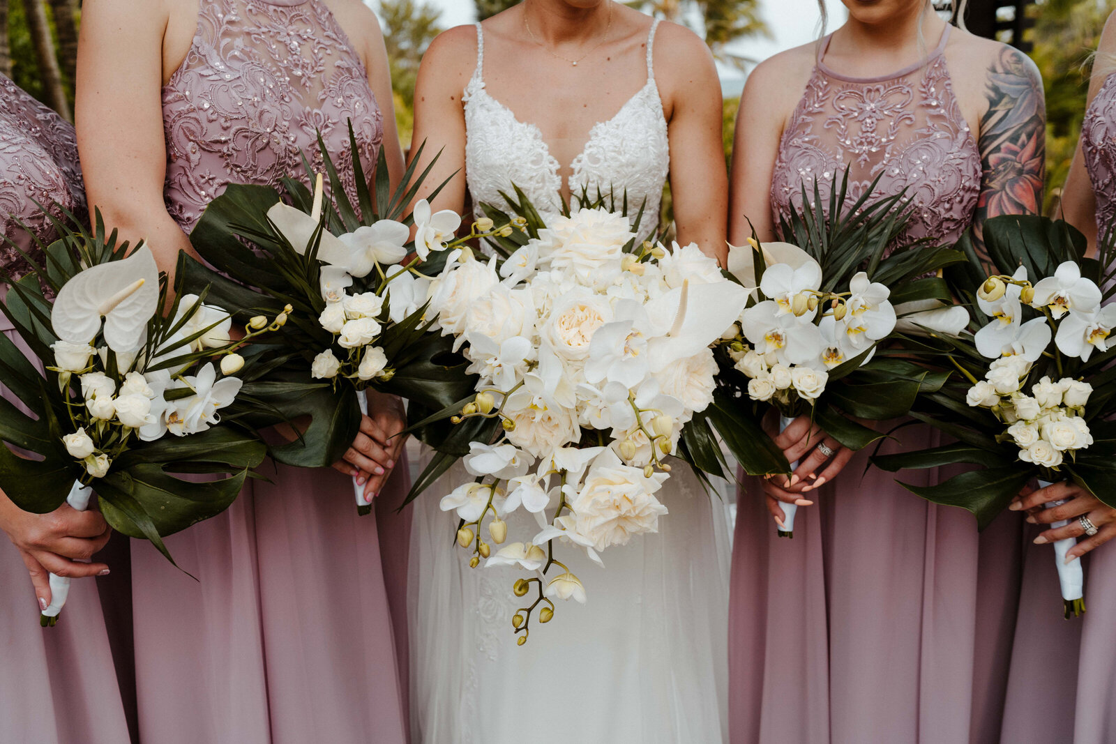 Destination wedding couple with wedding flowers