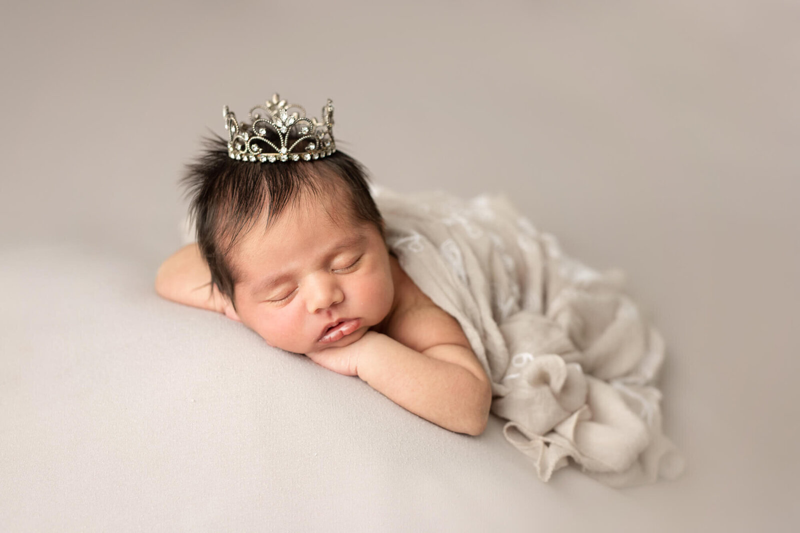Newborn girl in silver crown
