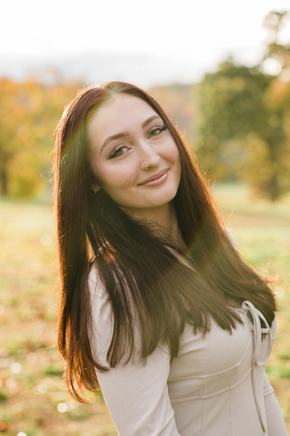 senior girl in park at sunset