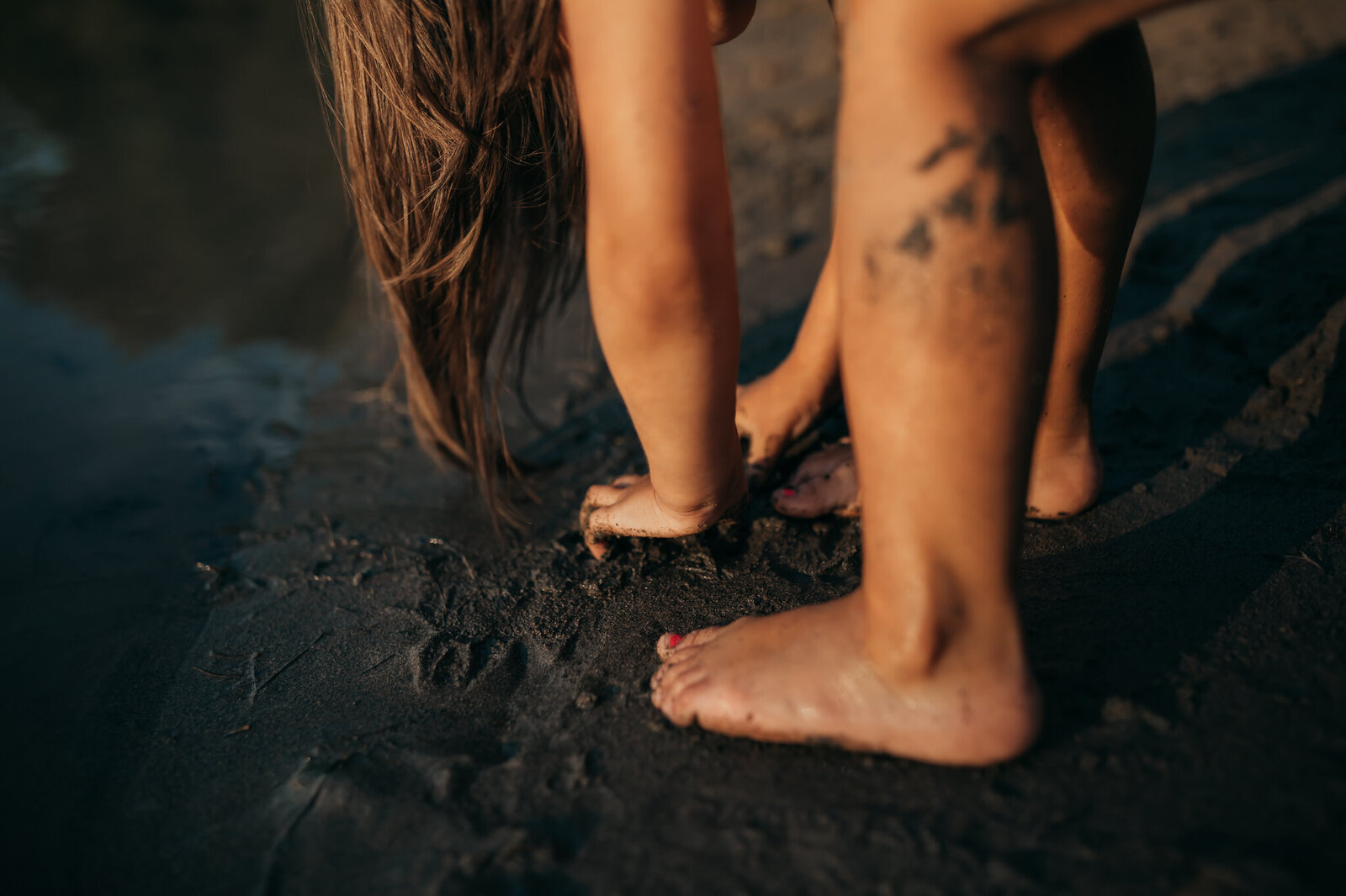 Child playing with beach sand