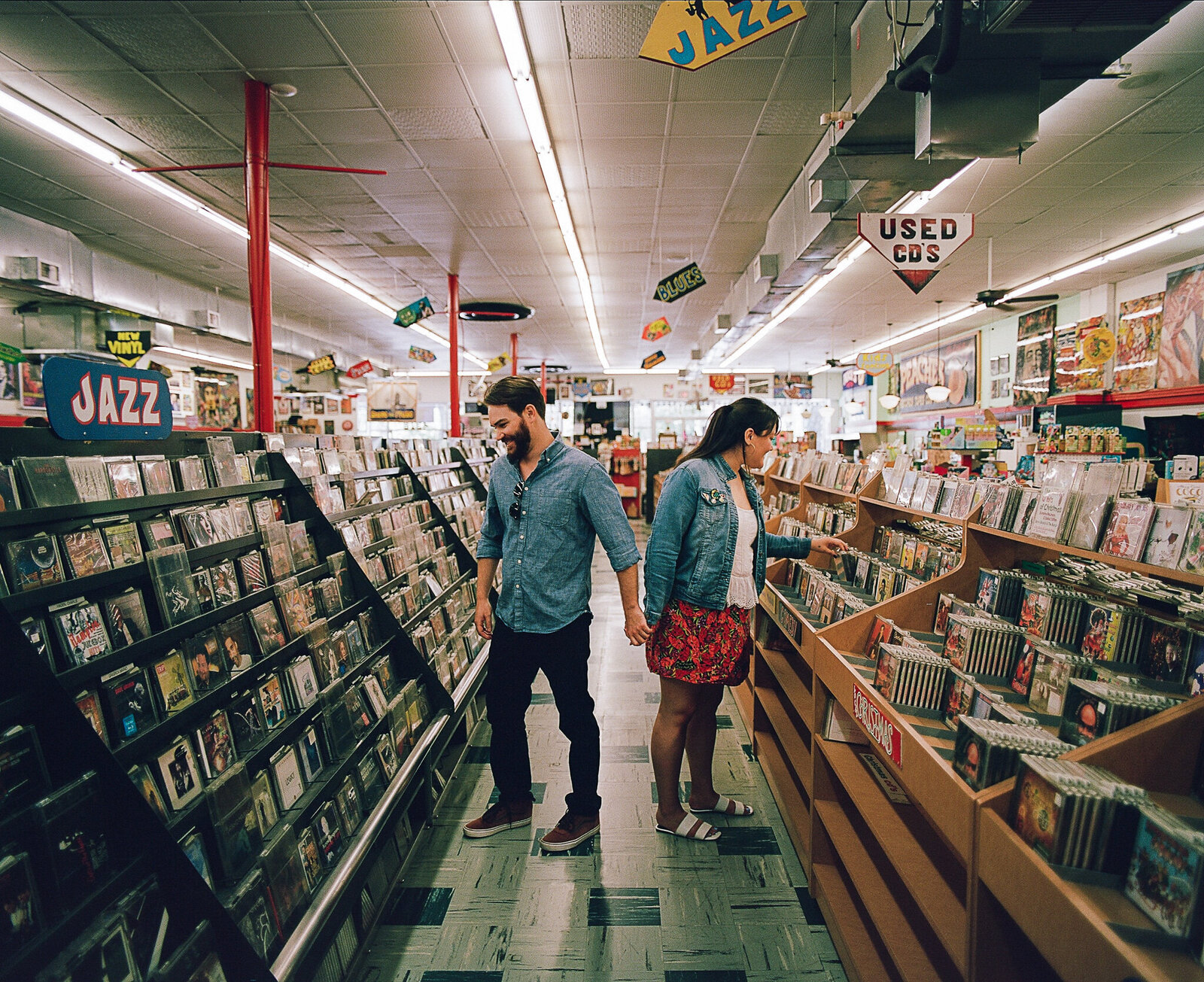 engagement photos record store engaged couple